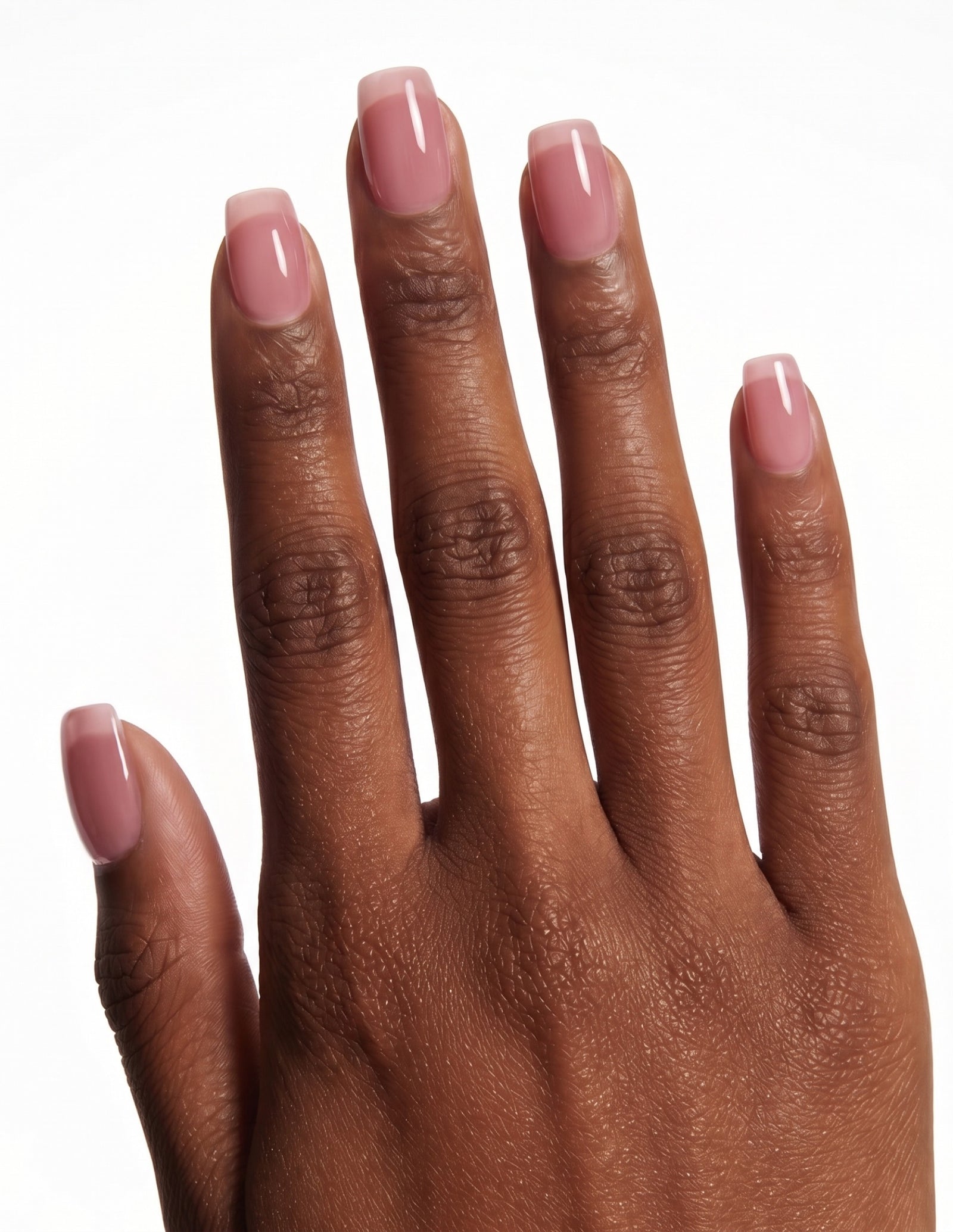 Dusty Rose press-on nails — Coffin (short), deep-skin hand, back of hand