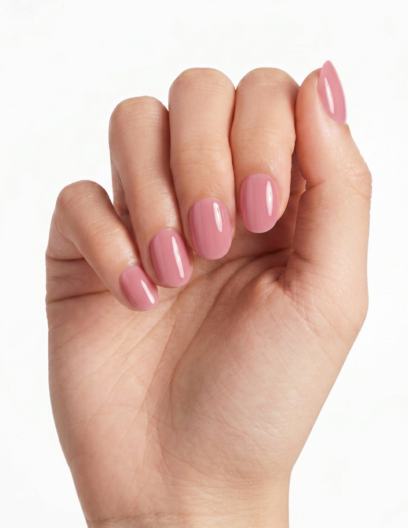Dusty Rose press-on nails — Oval (extra-short), light-skin hand, fingers curled