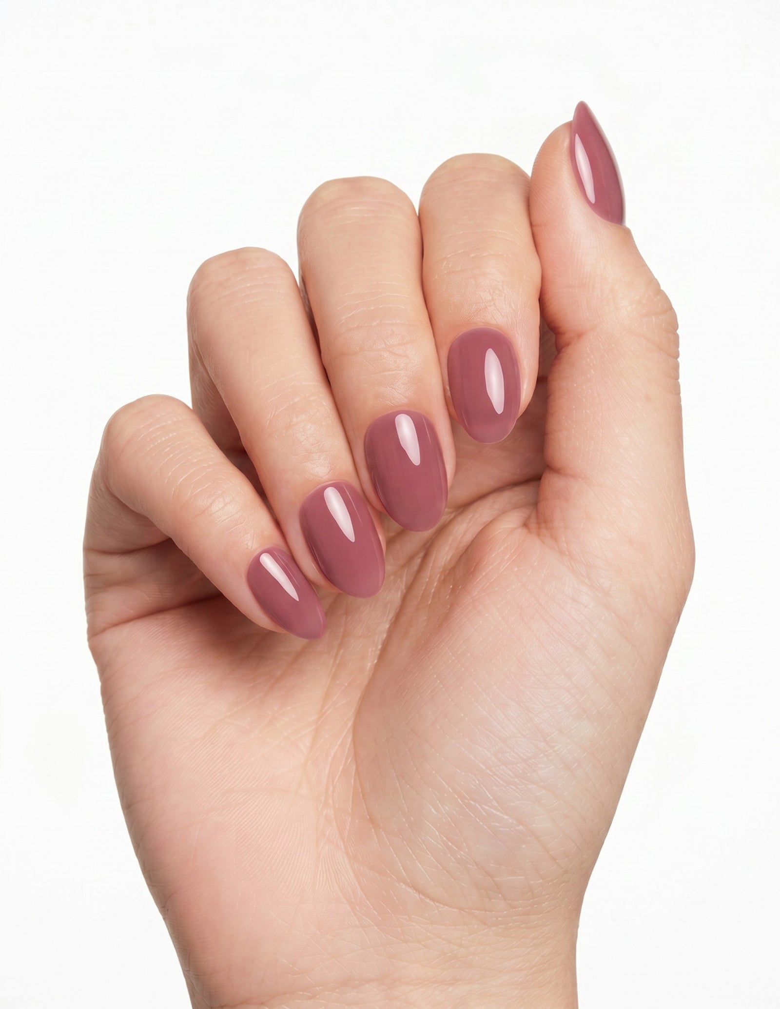 Mauve press-on nails — Almond (extra-short), light-skin hand, fingers curled