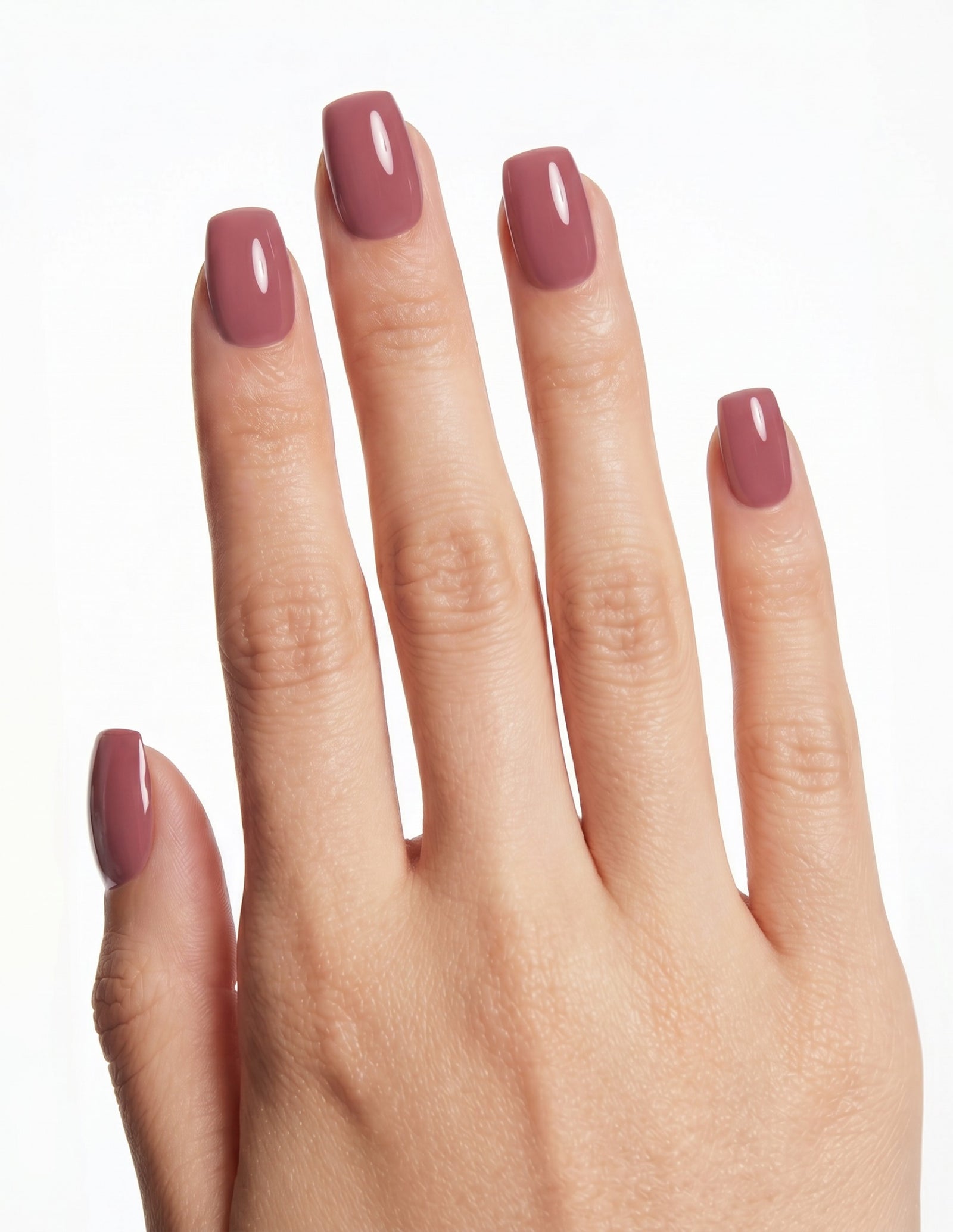 Mauve press-on nails — Coffin (short), deep-skin hand, back of hand