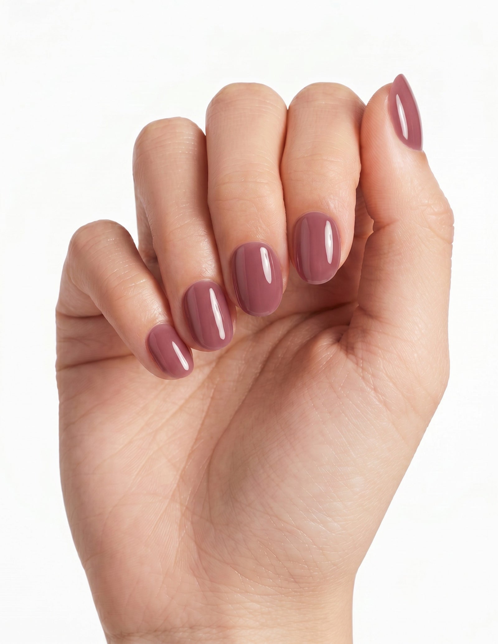 Mauve press-on nails — Oval (extra-short), light-skin hand, fingers curled