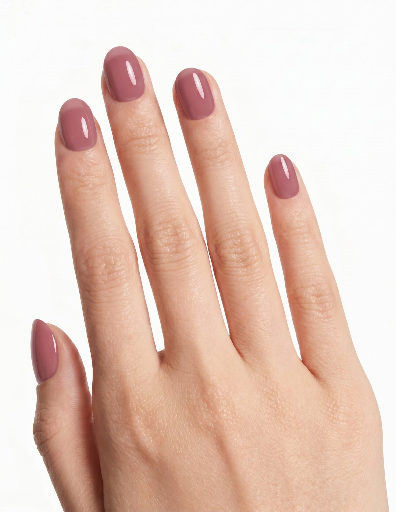 Mauve press-on nails — Oval (extra-short), light-skin hand, back of hand