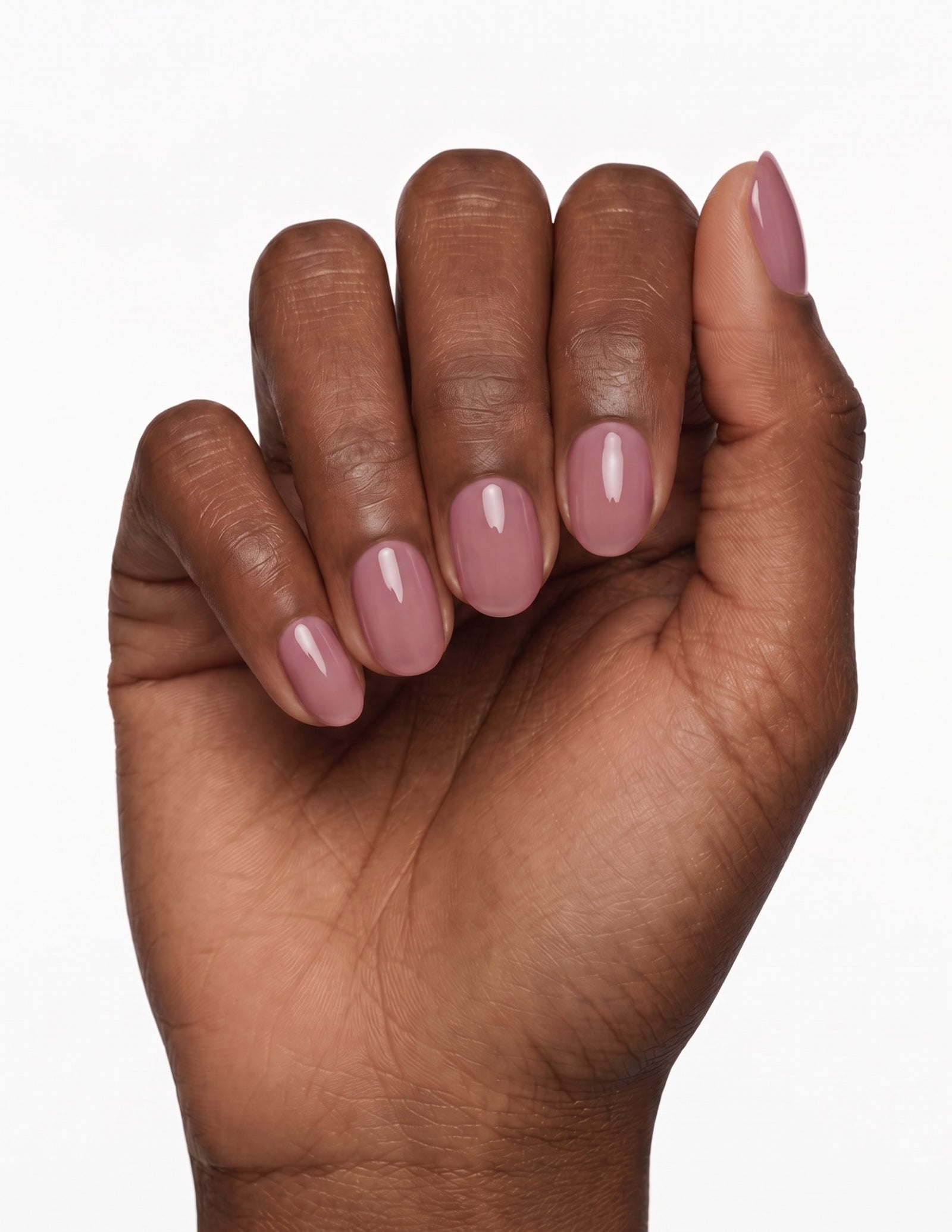 Mauve press-on nails — Oval (extra-short), deep-skin hand, fingers curled
