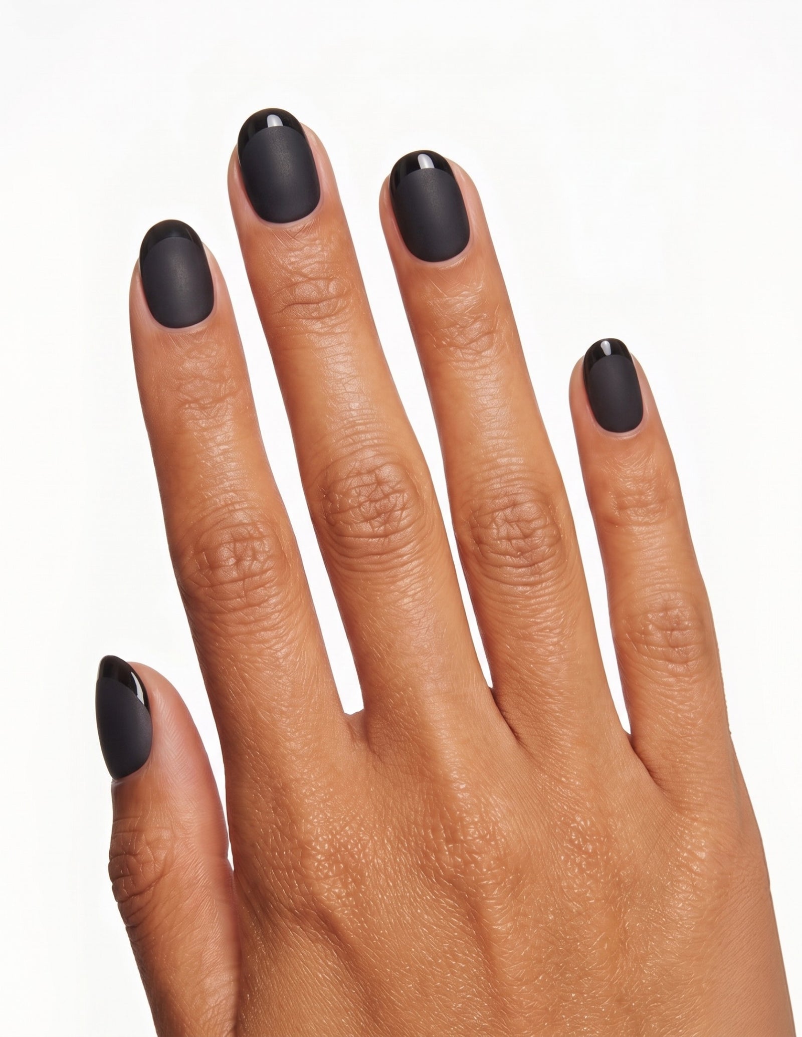 Ink press-on nails — Oval (extra-short), tan hand, back of hand