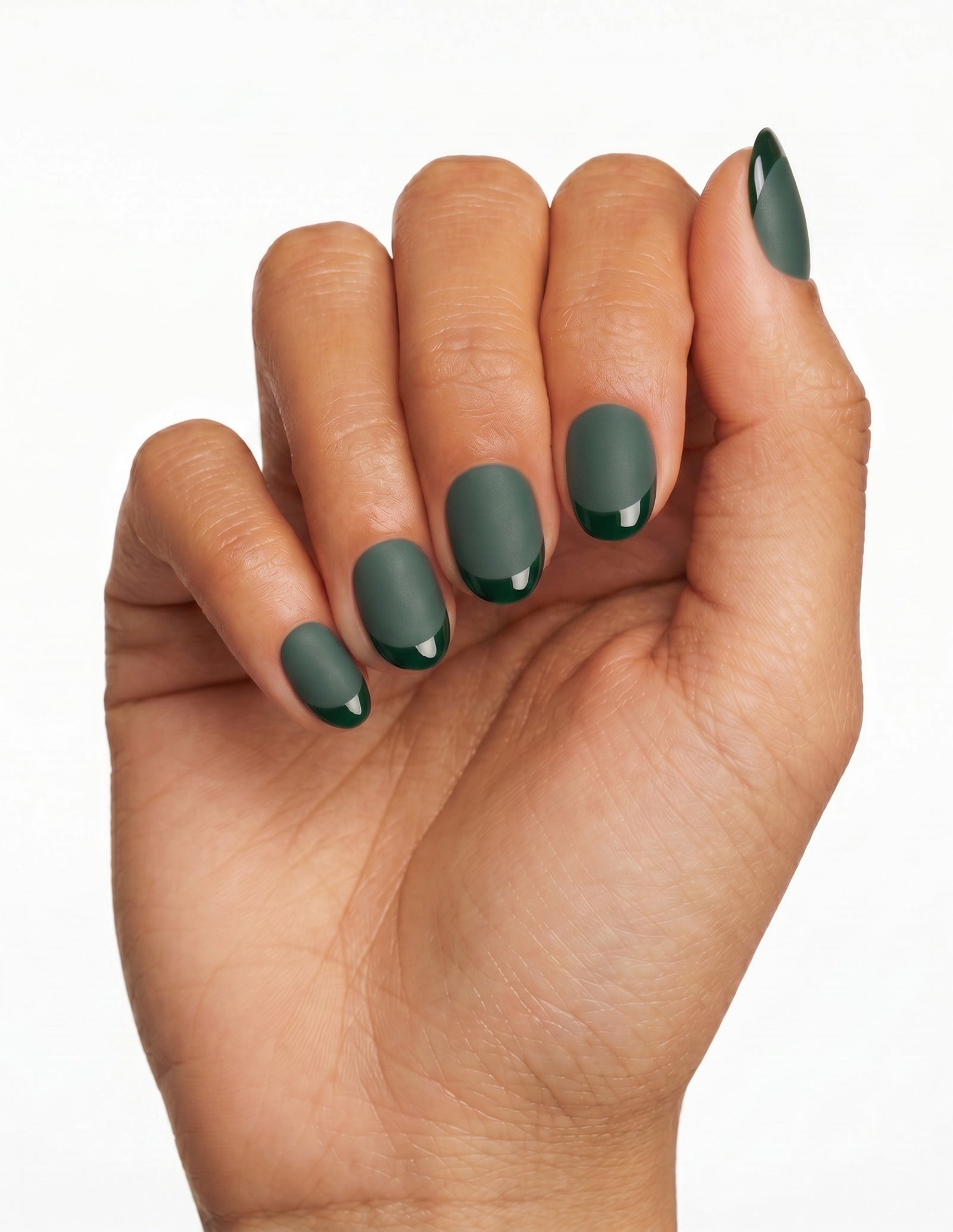 Forest press-on nails — Oval (extra-short), tan hand, fingers curled
