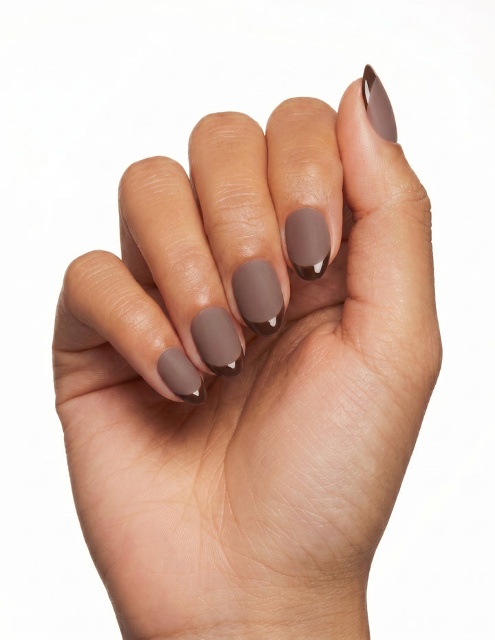 Cocoa press-on nails — Almond (extra-short), tan hand, fingers curled