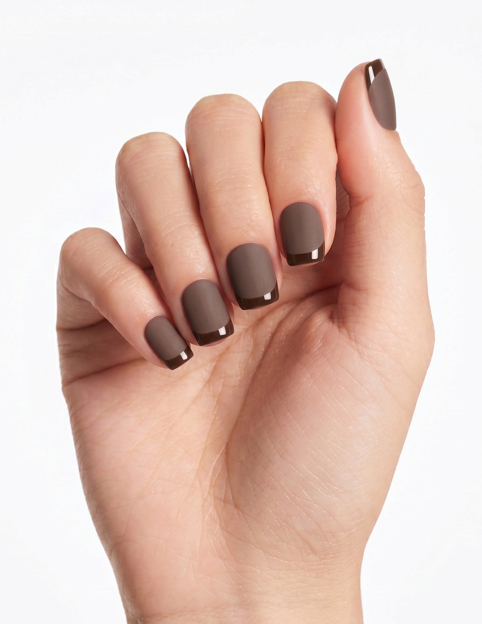 Cocoa press-on nails — Coffin (short), light-skin hand, fingers curled