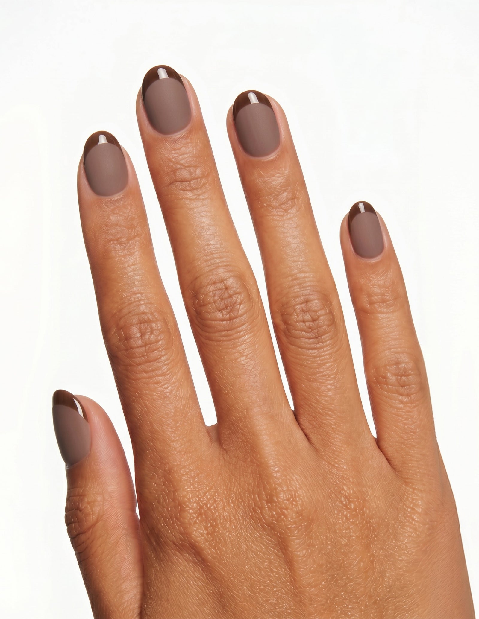 Cocoa press-on nails — Oval (extra-short), tan hand, back of hand