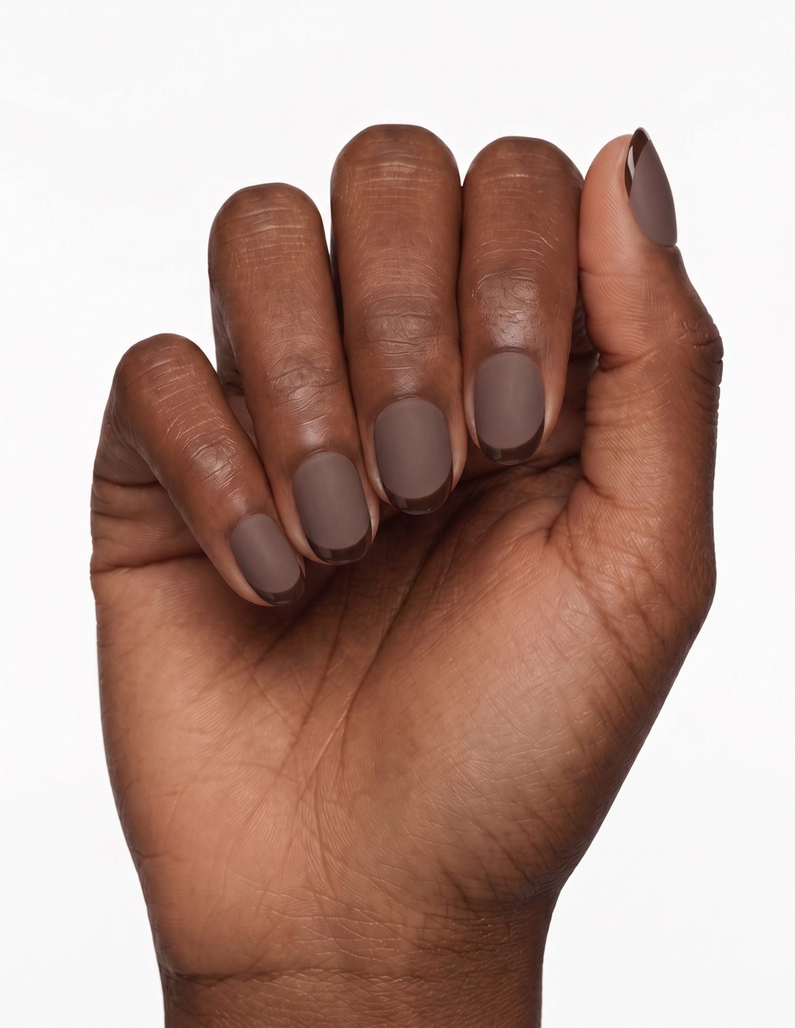 Cocoa press-on nails — Oval (extra-short), deep-skin hand, fingers curled