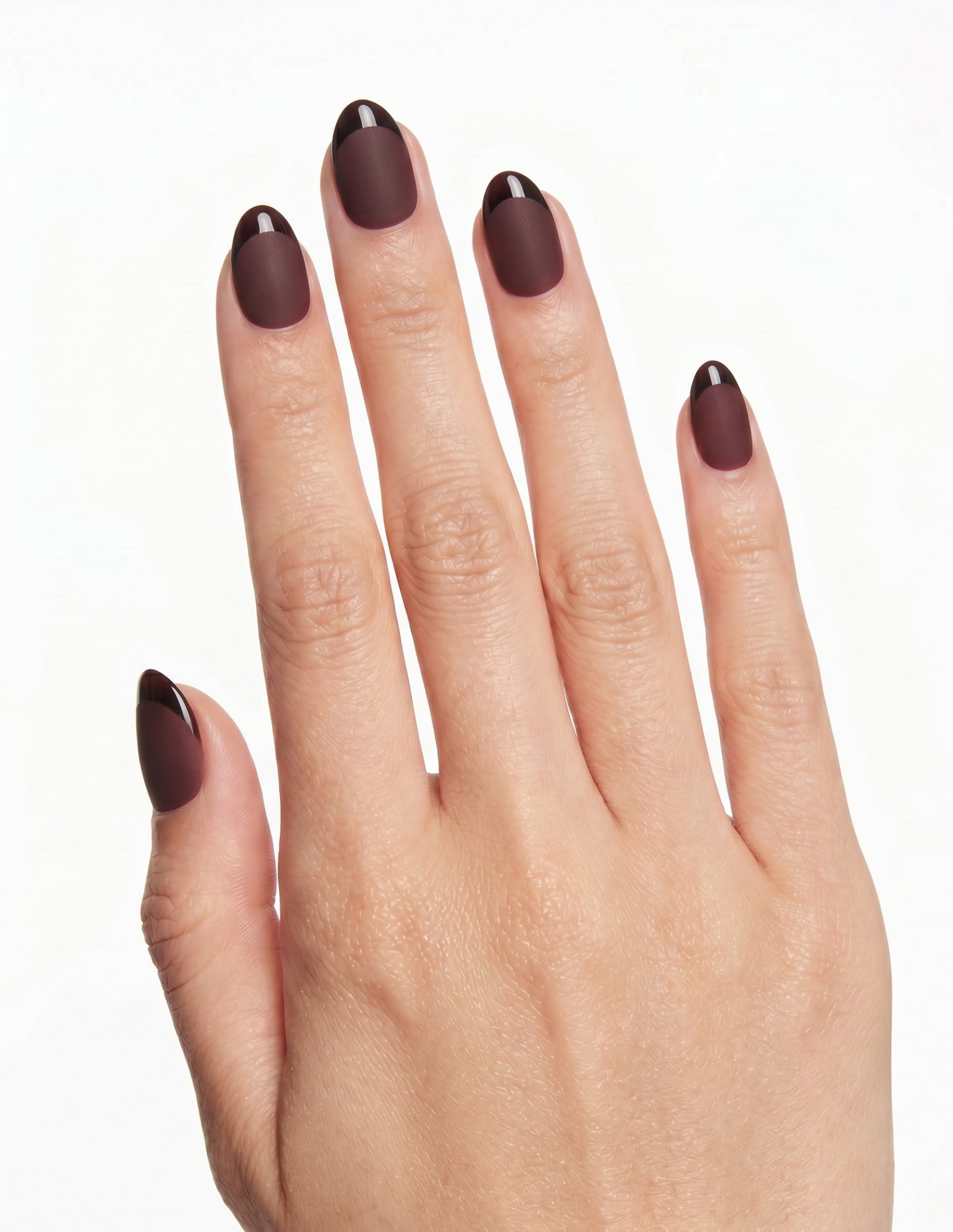 Bordeaux press-on nails — Almond (extra-short), light-skin hand, back of hand