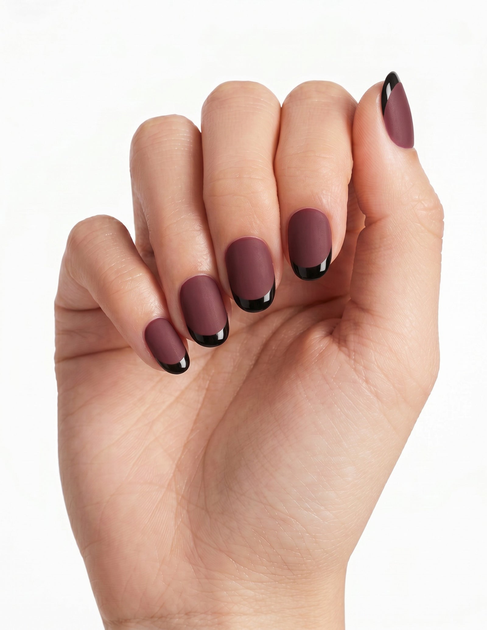 Bordeaux press-on nails — Oval (extra-short), light-skin hand, fingers curled