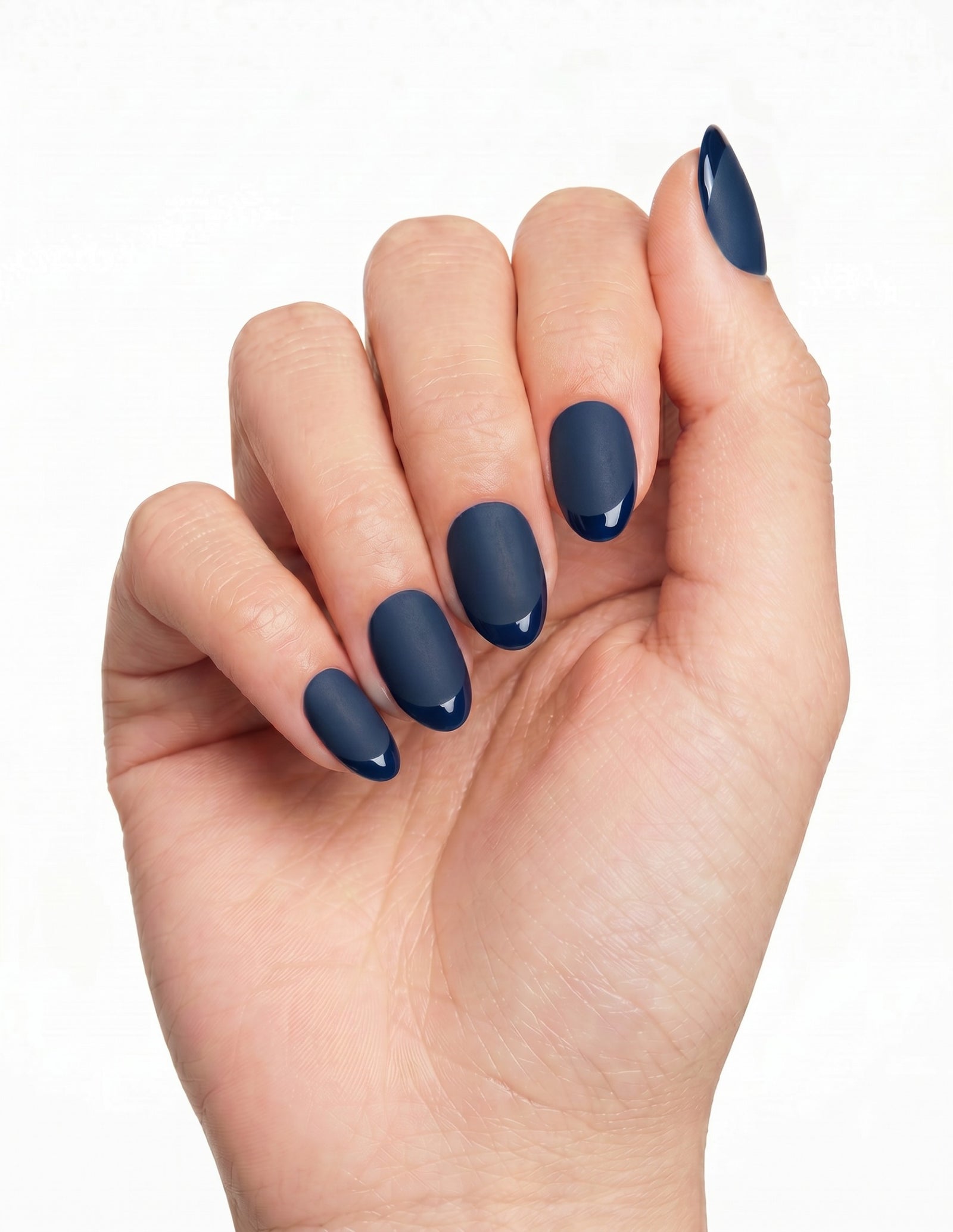 Midnight press-on nails — Almond (extra-short), deep-skin hand, fingers curled