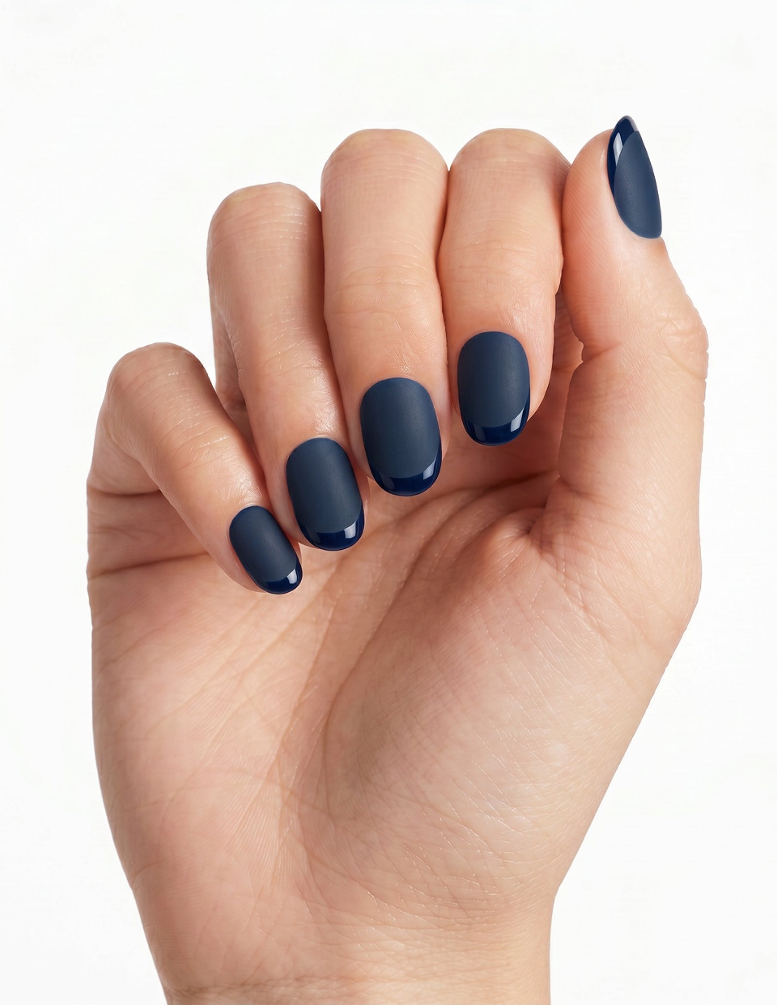 Midnight press-on nails — Oval (extra-short), light-skin hand, fingers curled