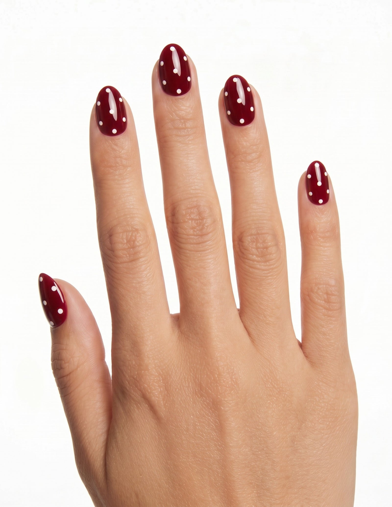 Strawberry press-on nails — Almond (extra-short), tan hand, back of hand