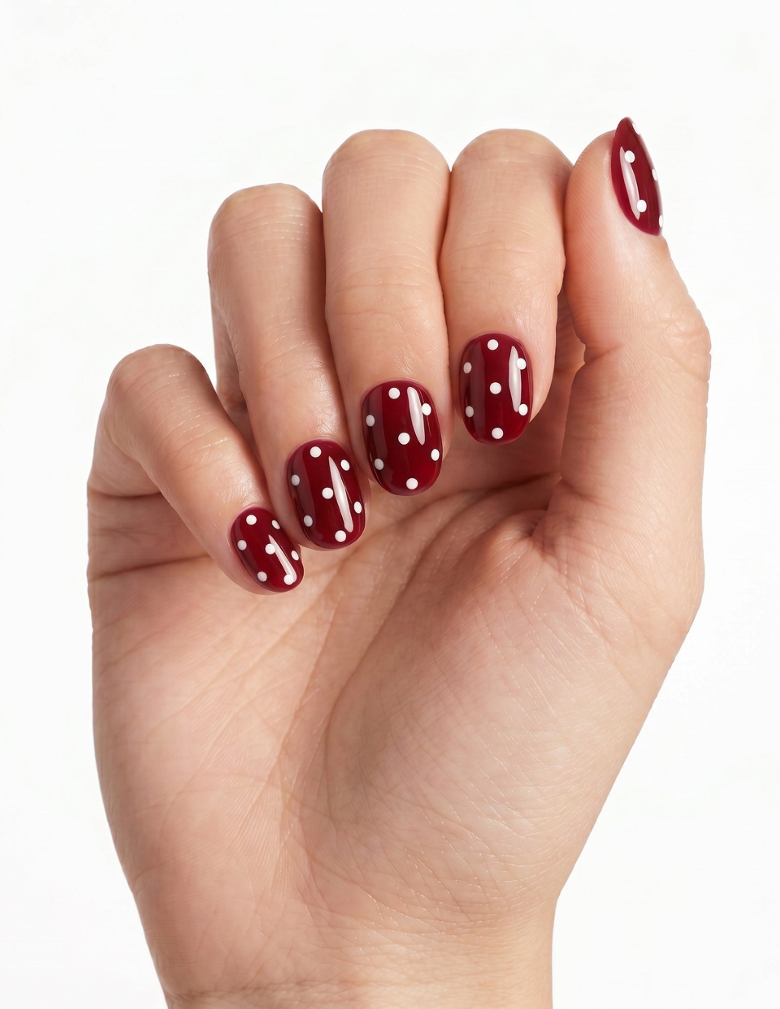 Strawberry press-on nails — Oval (extra-short), light-skin hand, fingers curled