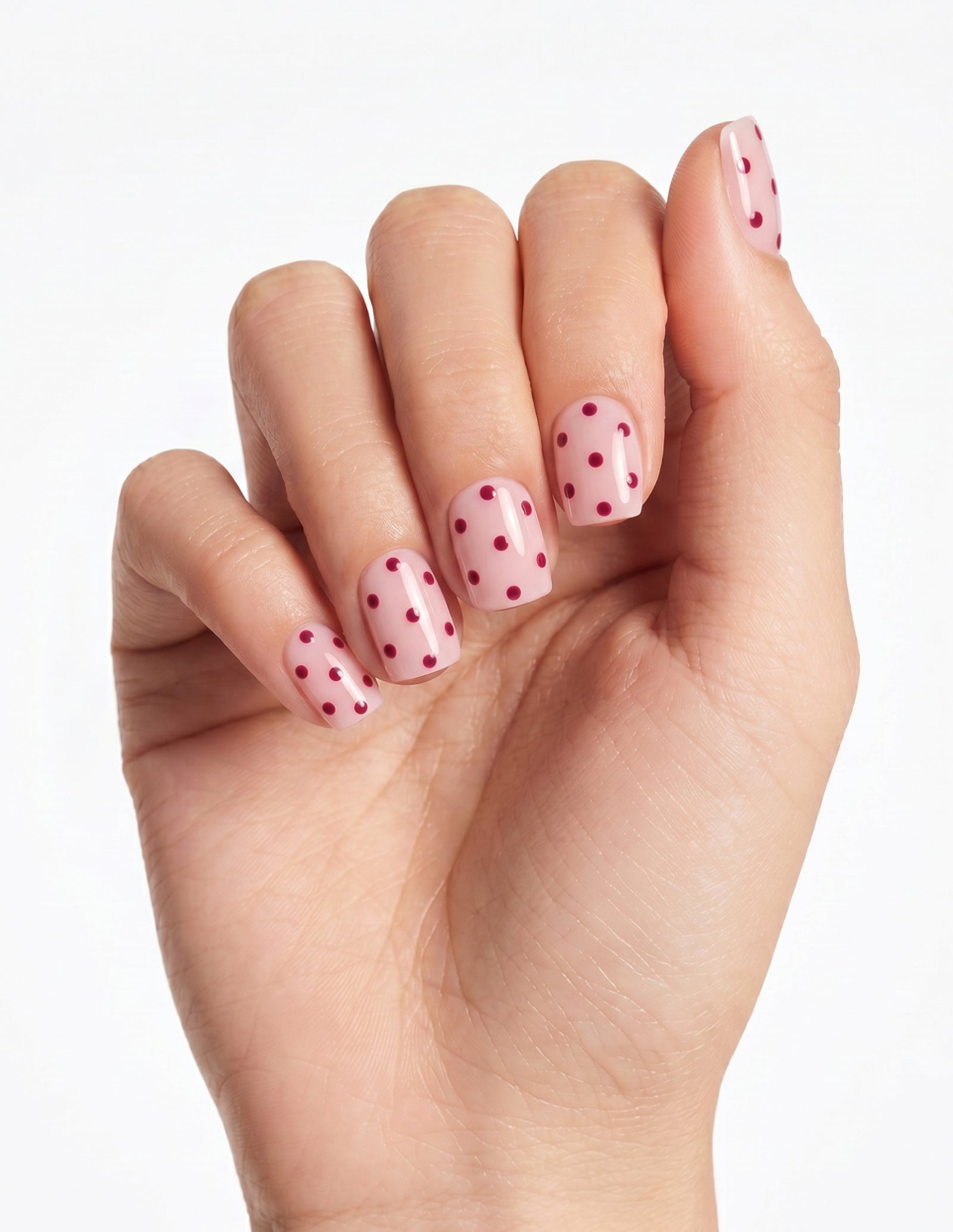 Strawberry Milk press-on nails — Coffin (short), light-skin hand, fingers curled