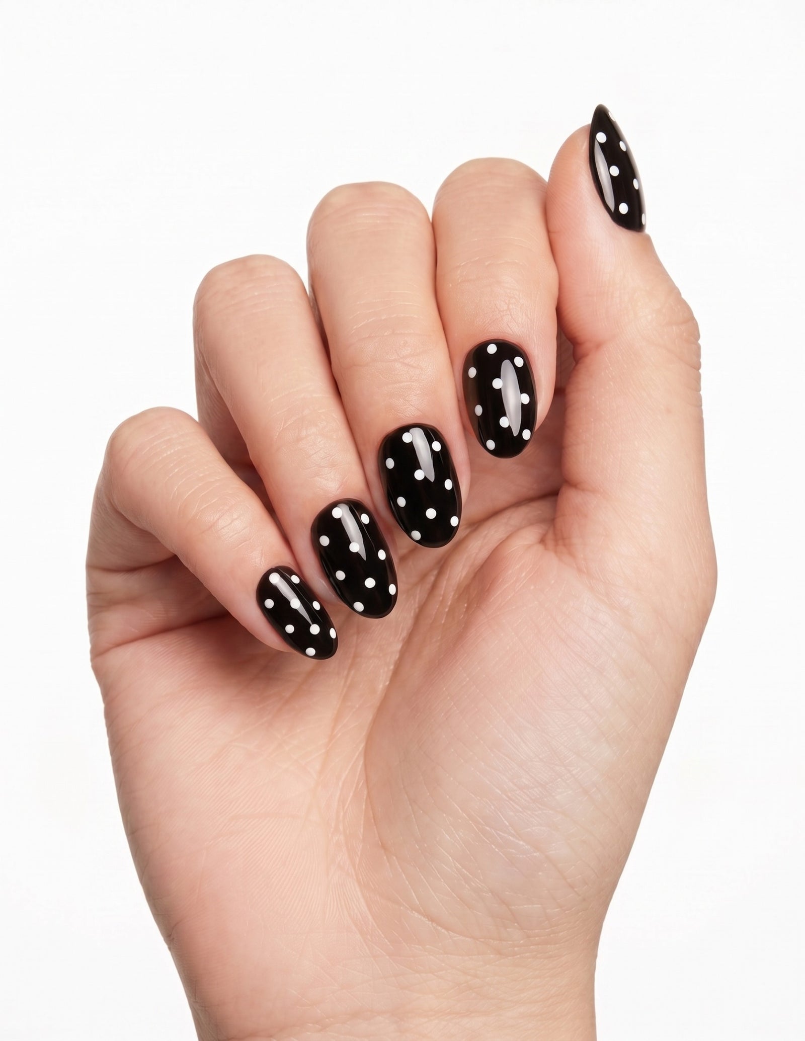 Dice press-on nails — Almond (extra-short), light-skin hand, fingers curled