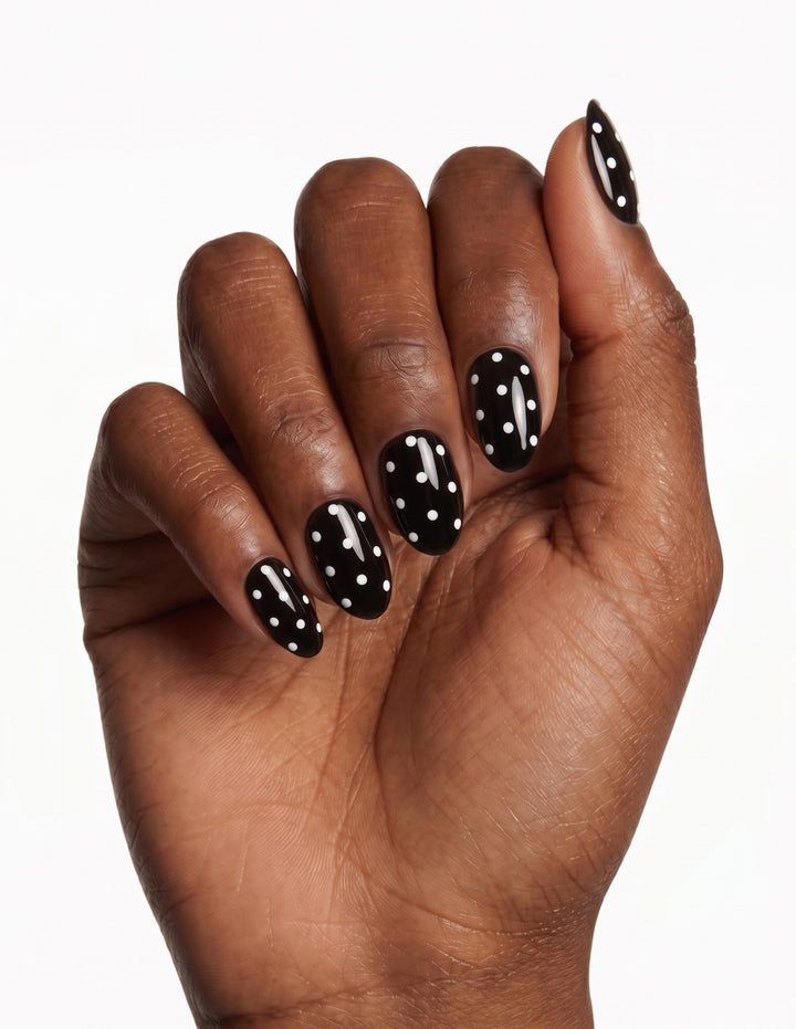 Dice press-on nails — Almond (extra-short), deep-skin hand, fingers curled