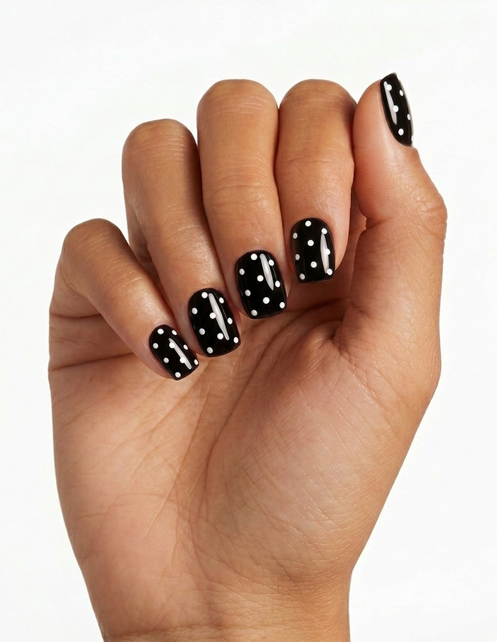 Dice press-on nails — Coffin (short), tan hand, fingers curled