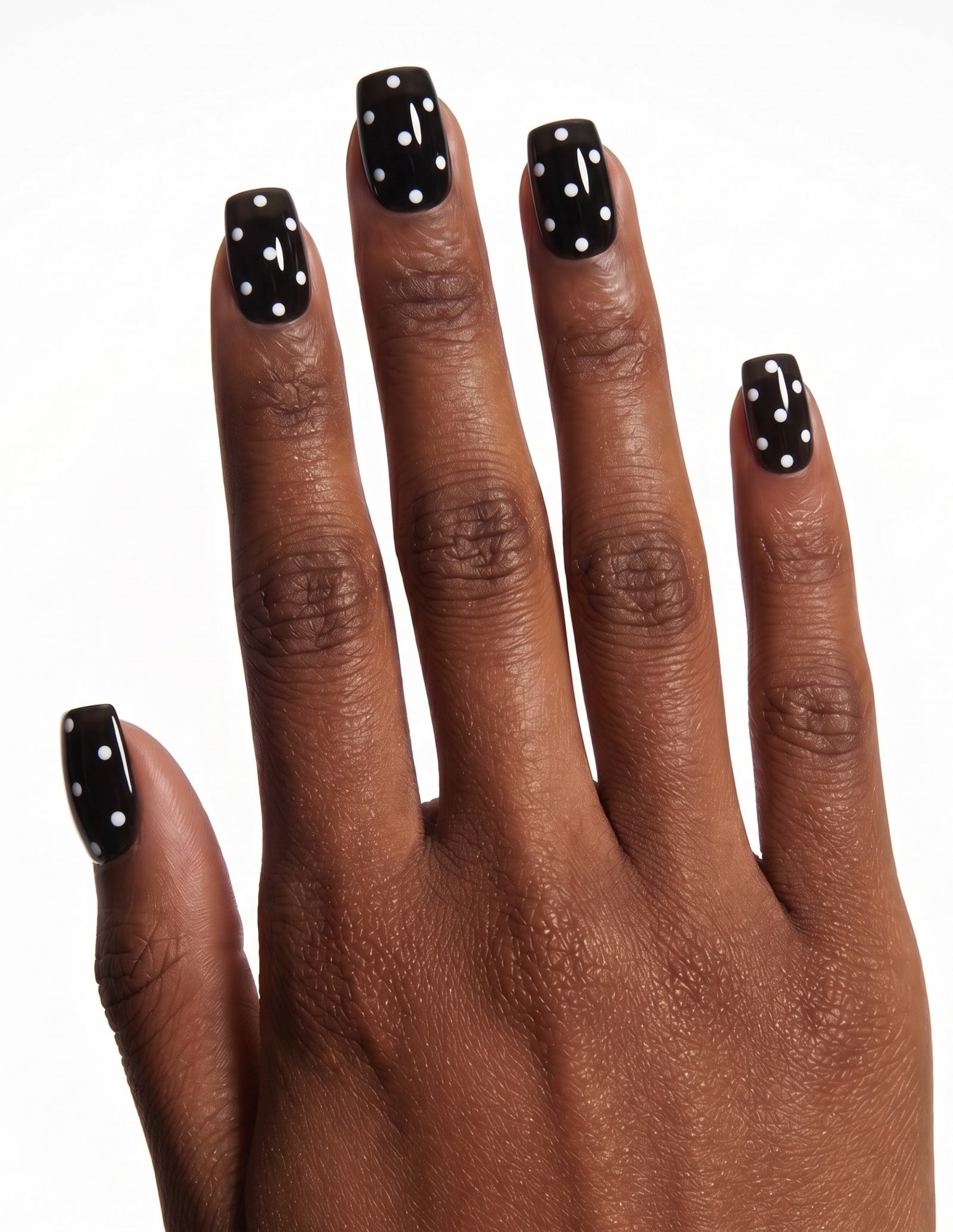 Dice press-on nails — Coffin (short), deep-skin hand, back of hand