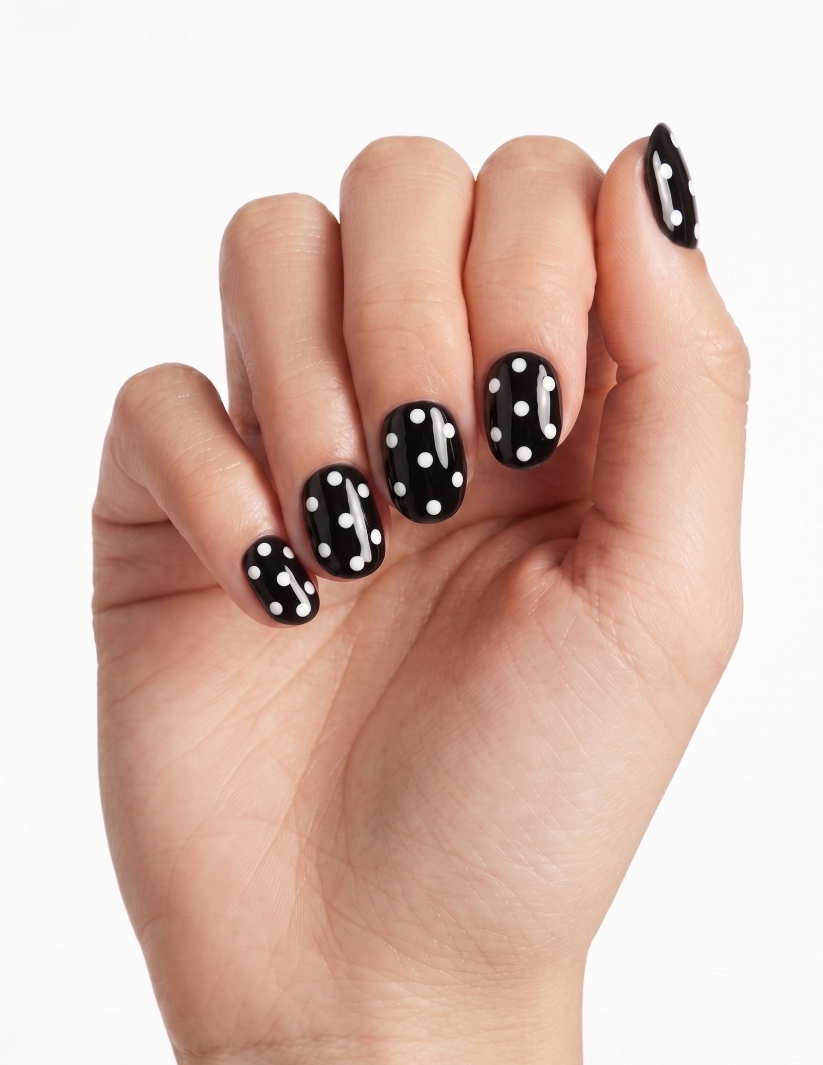 Dice press-on nails — Oval (extra-short), light-skin hand, fingers curled