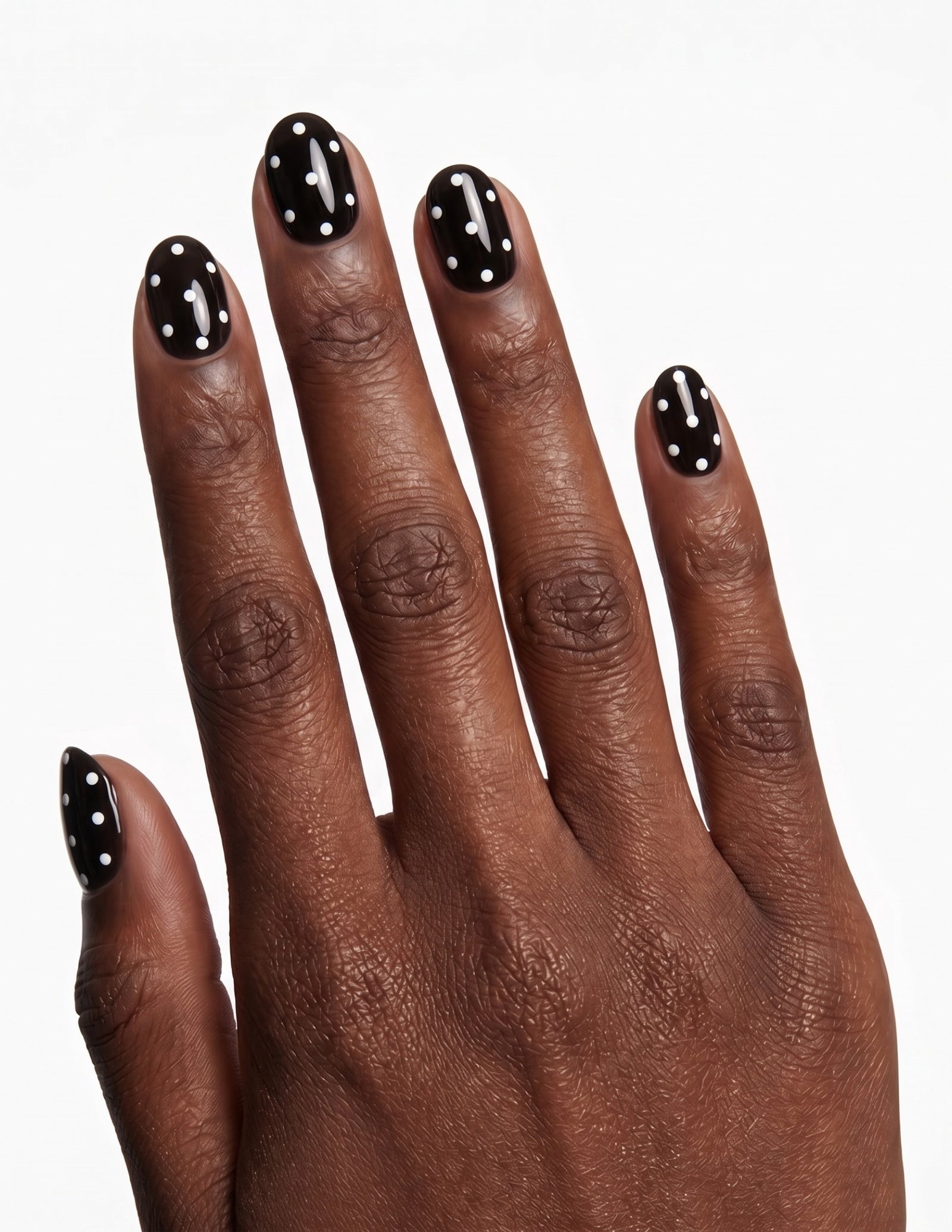 Dice press-on nails — Oval (extra-short), deep-skin hand, back of hand