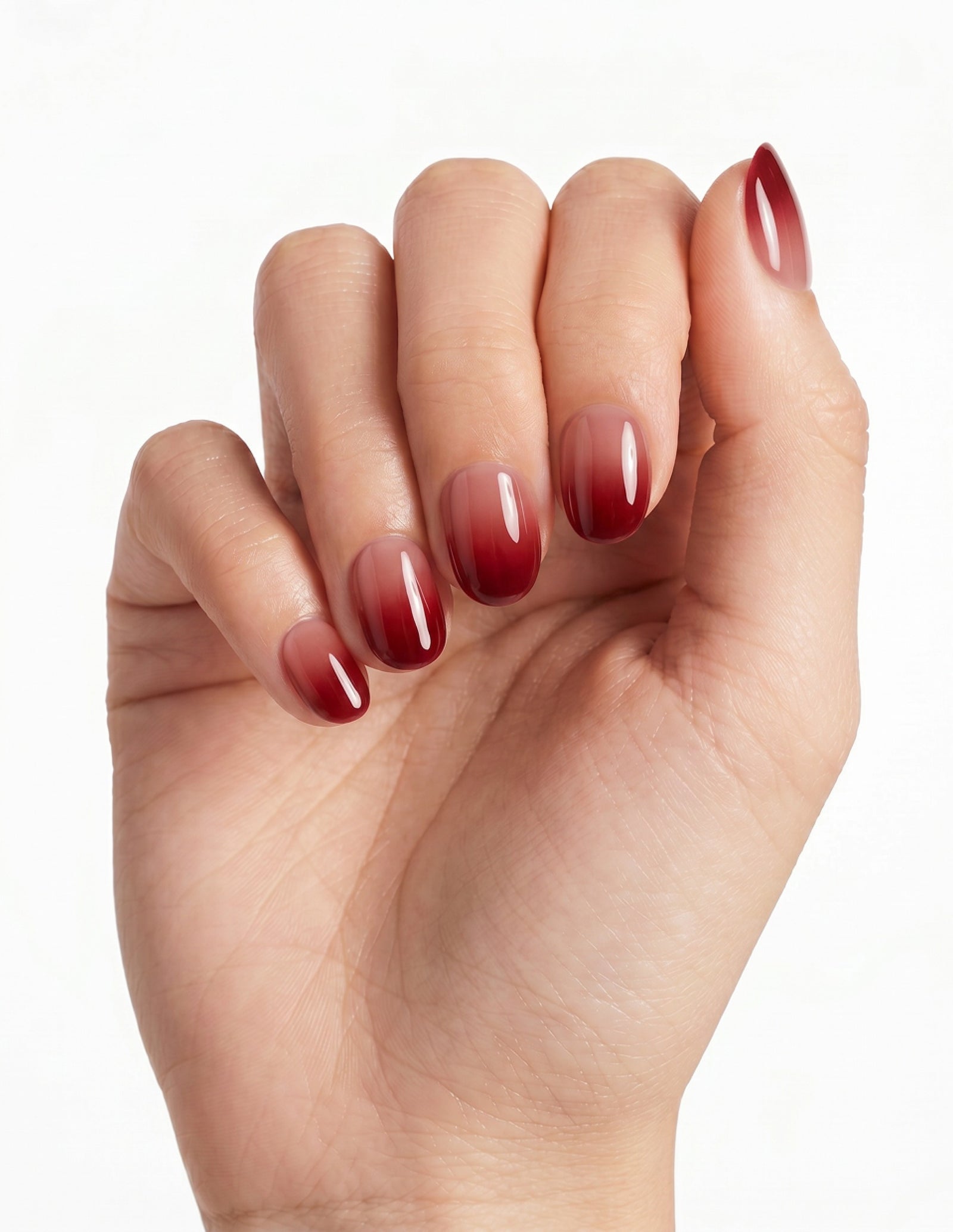 Cherry Cola press-on nails — Oval (extra-short), light-skin hand, fingers curled