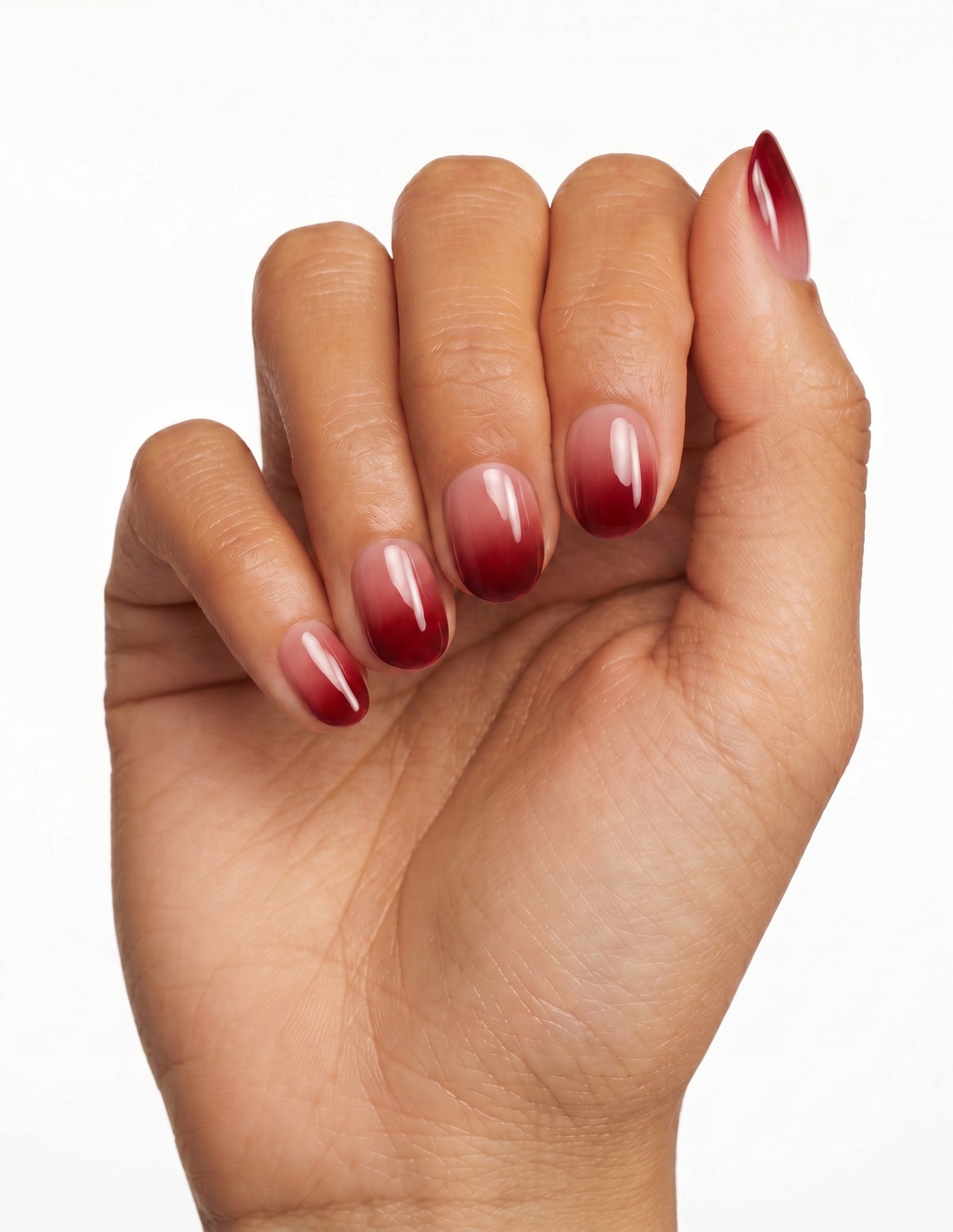 Cherry Cola press-on nails — Oval (extra-short), deep-skin hand, fingers curled