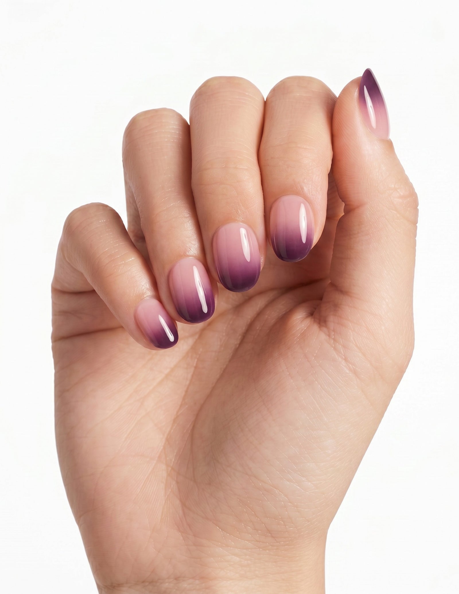 Plum Fade press-on nails — Oval (extra-short), light-skin hand, fingers curled