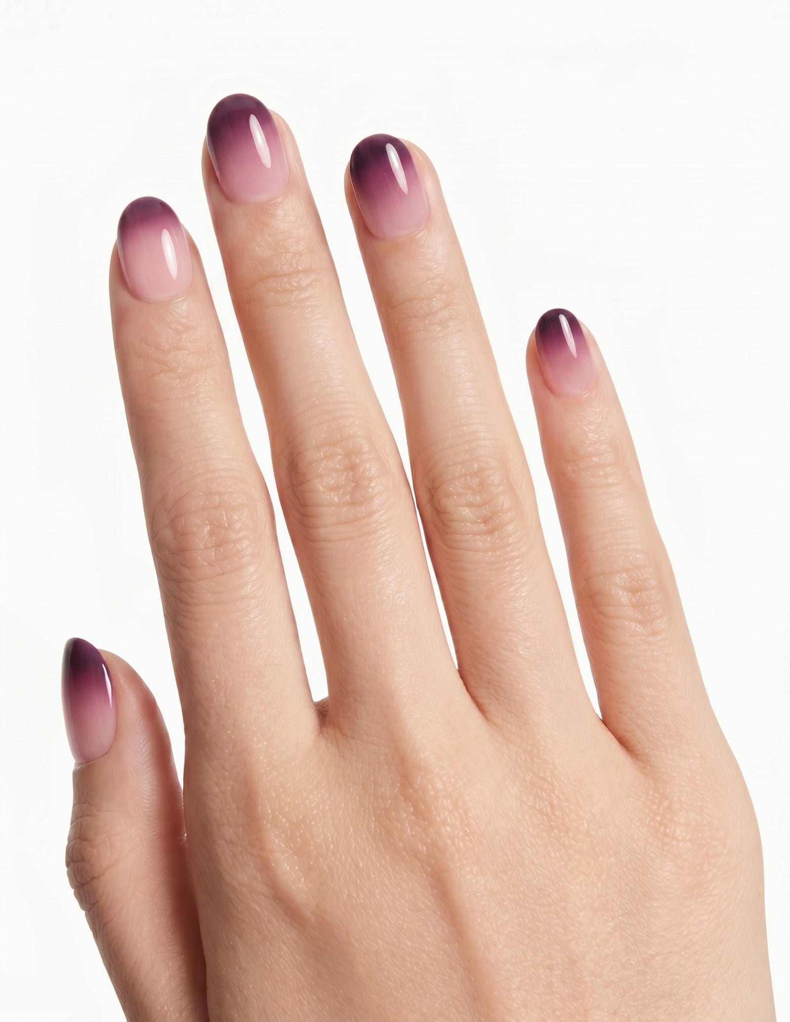 Plum Fade press-on nails — Oval (extra-short), light-skin hand, back of hand