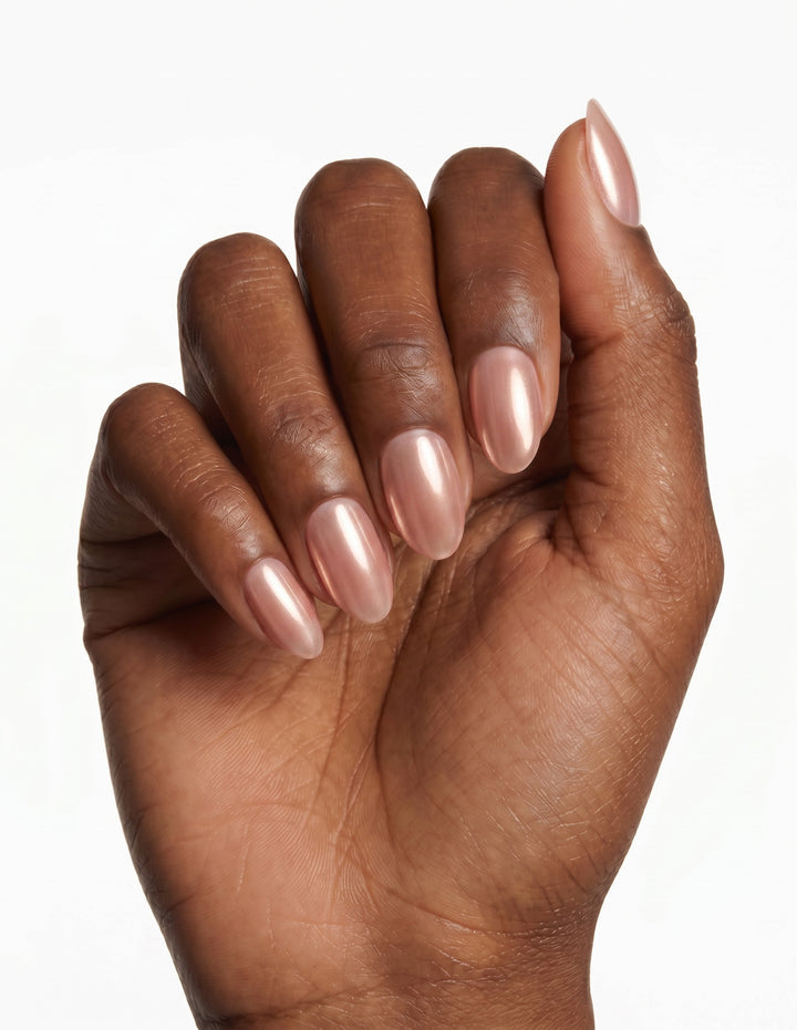 Rose Chrome press-on nails — Almond (extra-short), deep-skin hand, fingers curled