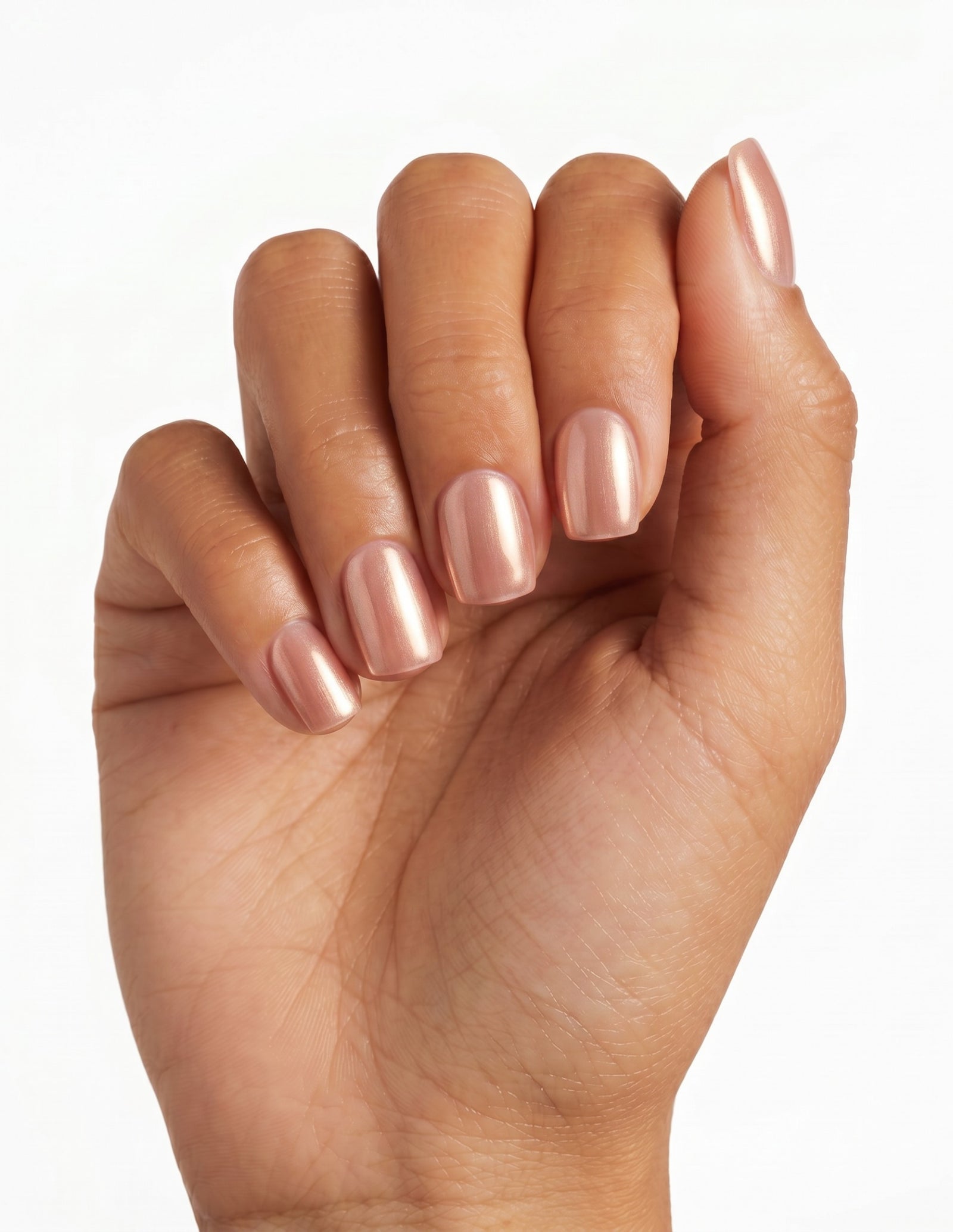 Rose Chrome press-on nails — Coffin (short), tan hand, fingers curled