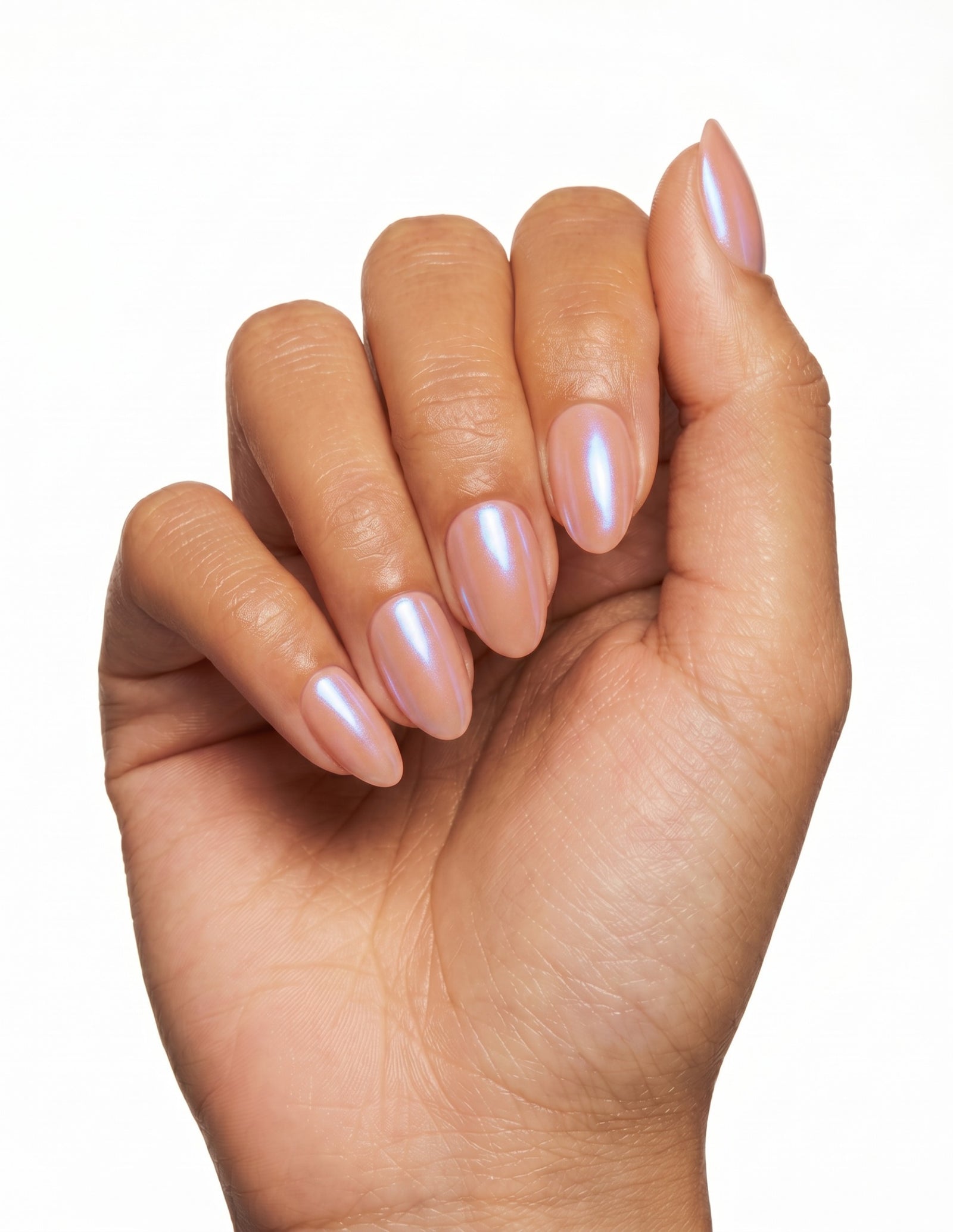 Peach Fuzz press-on nails — Almond (extra-short), tan hand, fingers curled