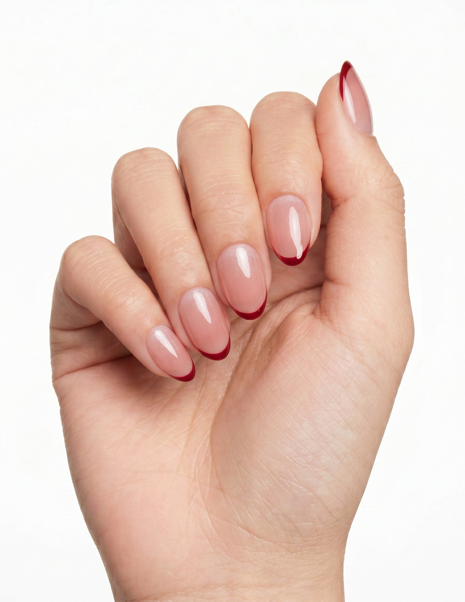 Cherry French press-on nails — Almond (extra-short), light-skin hand, fingers curled