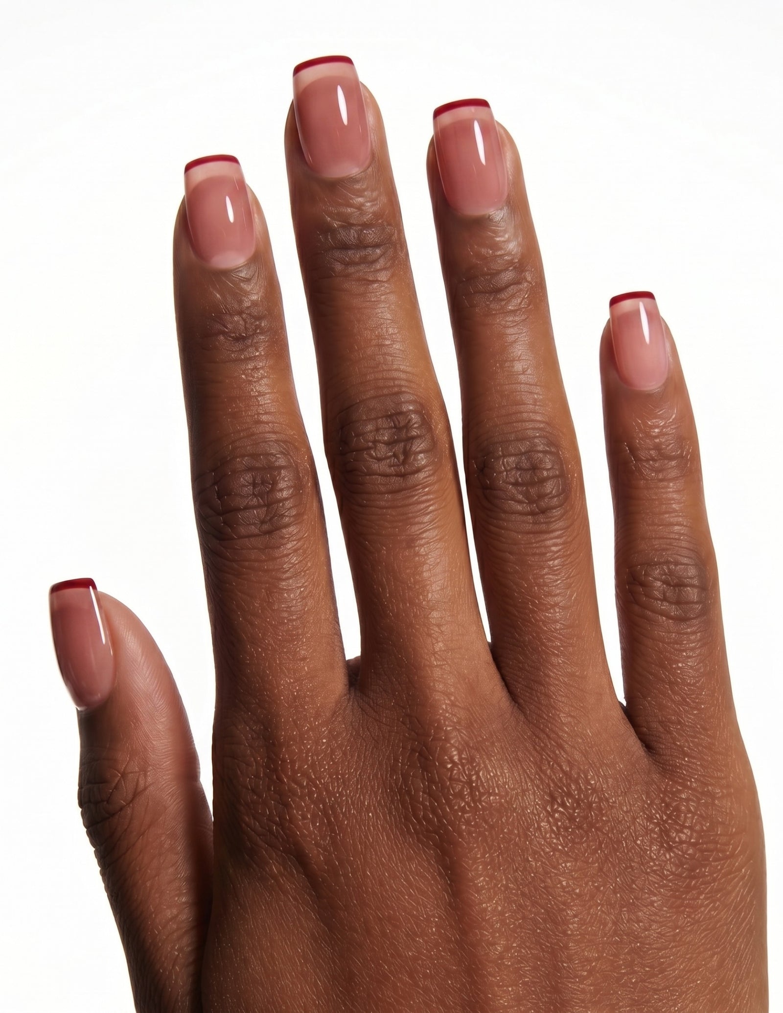 Cherry French press-on nails — Coffin (short), deep-skin hand, back of hand