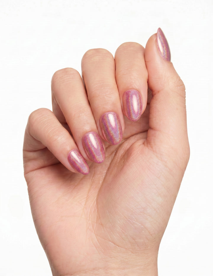 Pink Velvet press-on nails — Almond (extra-short), tan hand, fingers curled