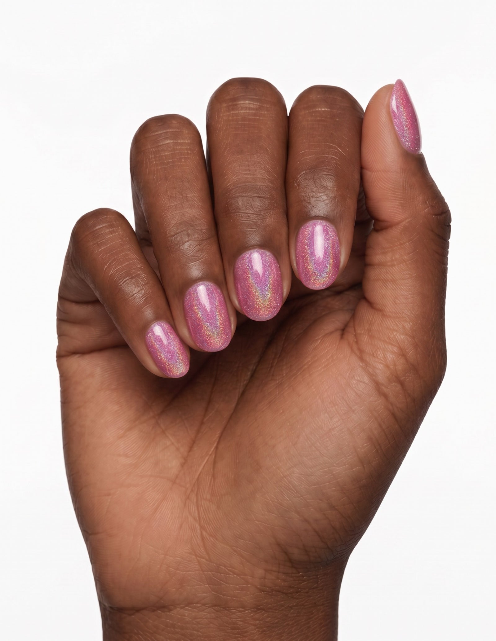 Pink Velvet press-on nails — Oval (extra-short), deep-skin hand, fingers curled