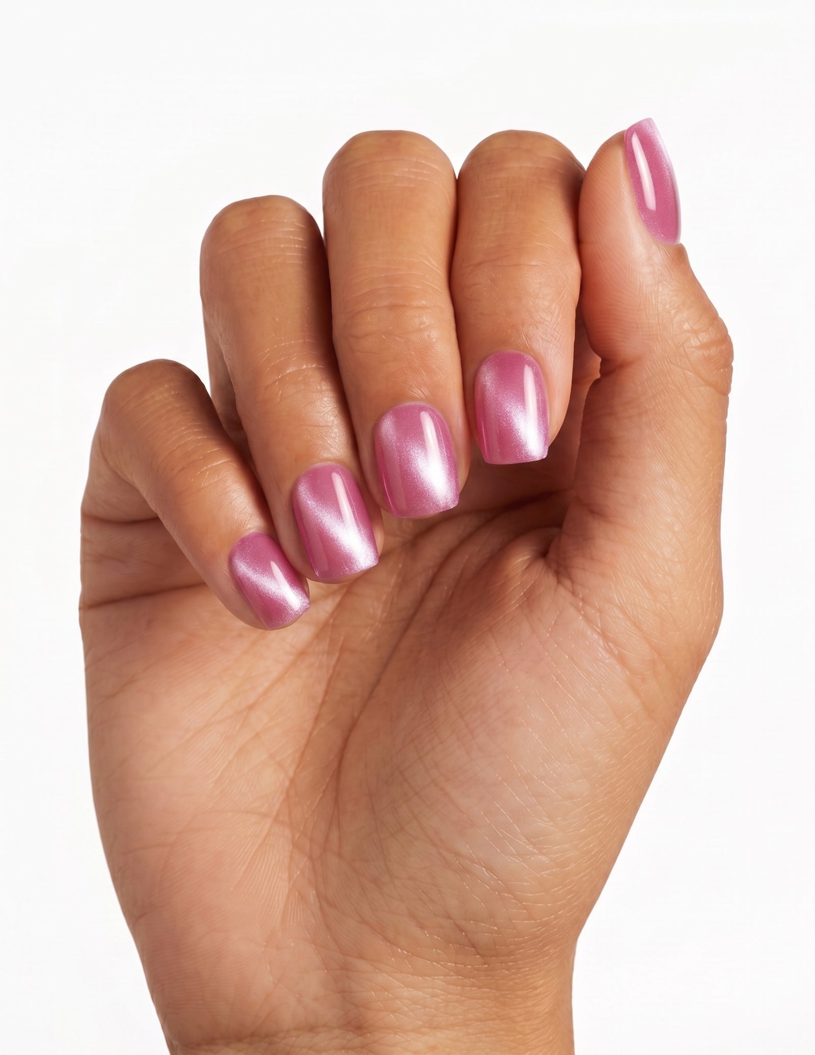 Raspberry Velvet press-on nails — Coffin (short), tan hand, fingers curled