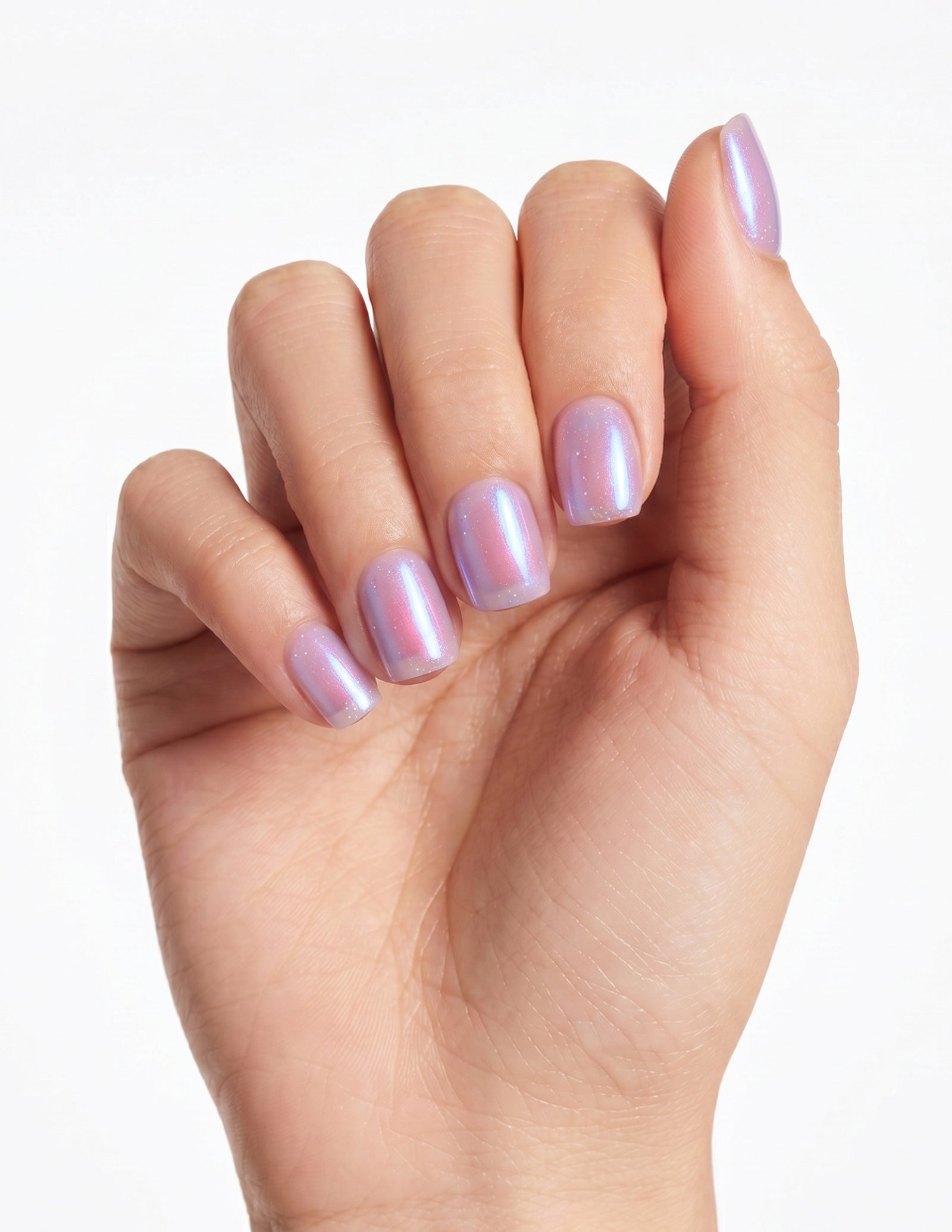 Lilac Chrome press-on nails — Coffin (short), light-skin hand, fingers curled