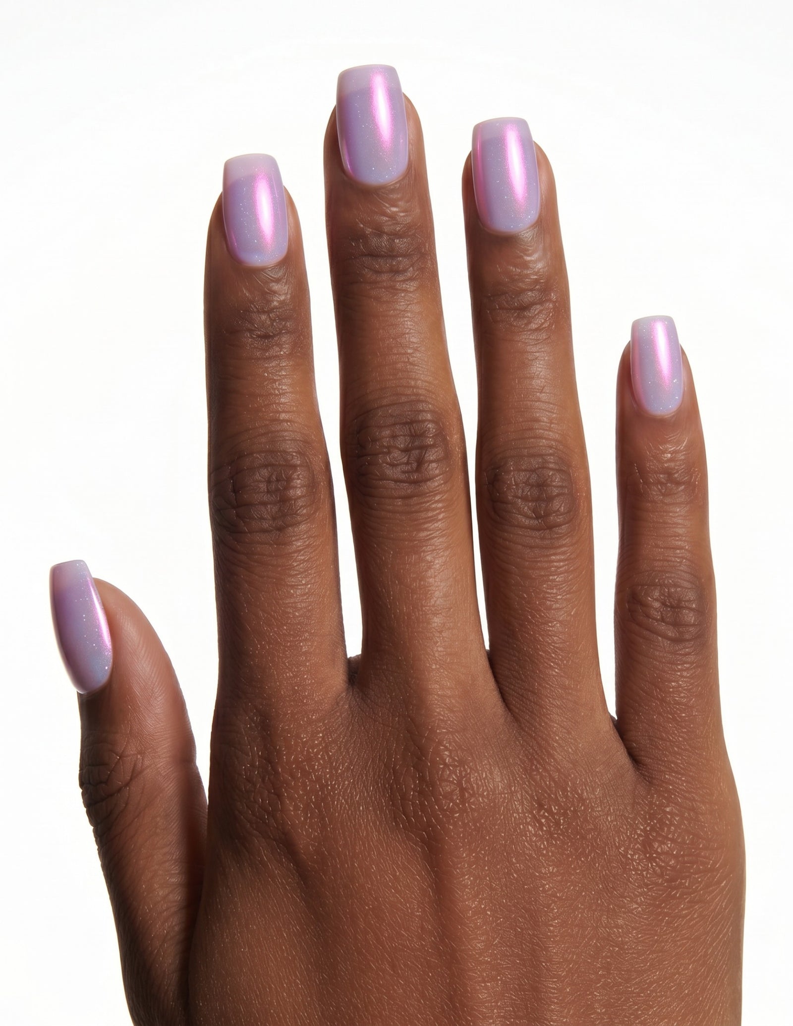 Lilac Chrome press-on nails — Coffin (short), deep-skin hand, back of hand