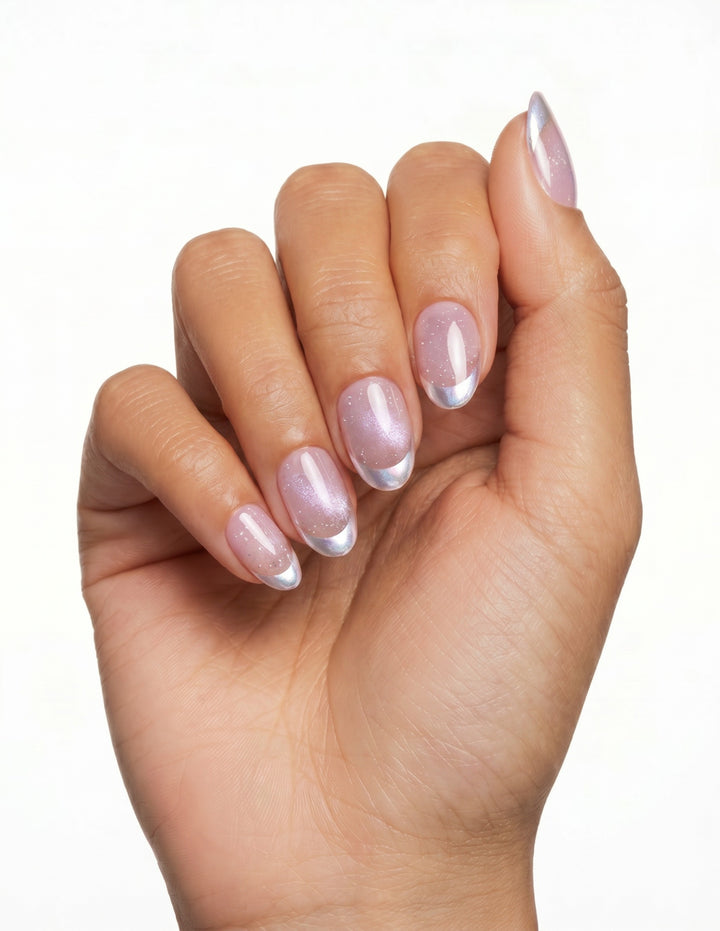 Sugar Tips press-on nails — Almond (extra-short), tan hand, fingers curled
