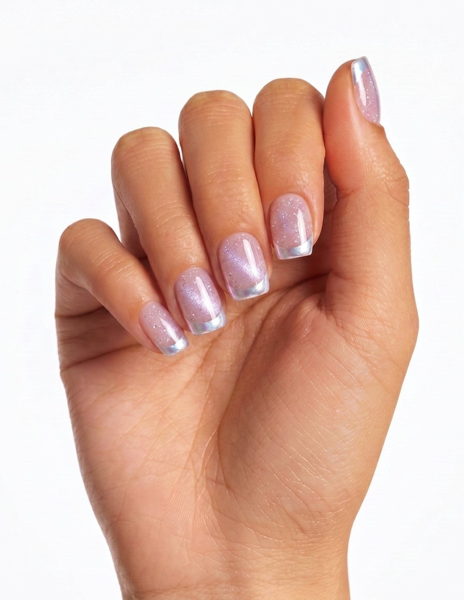 Sugar Tips press-on nails — Coffin (short), tan hand, fingers curled