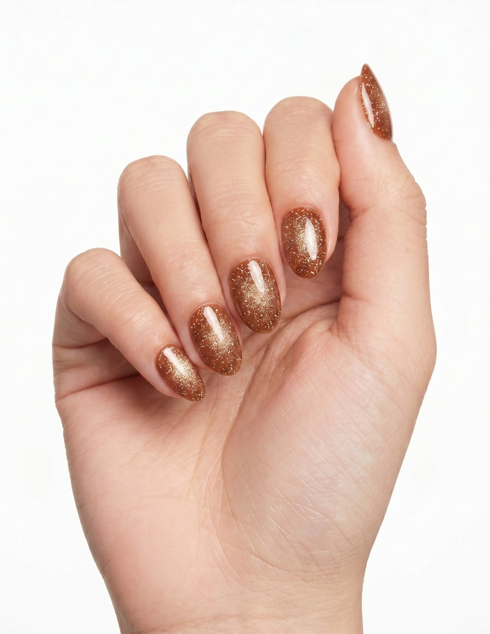 Cinnamon Velvet press-on nails — Almond (extra-short), light-skin hand, fingers curled