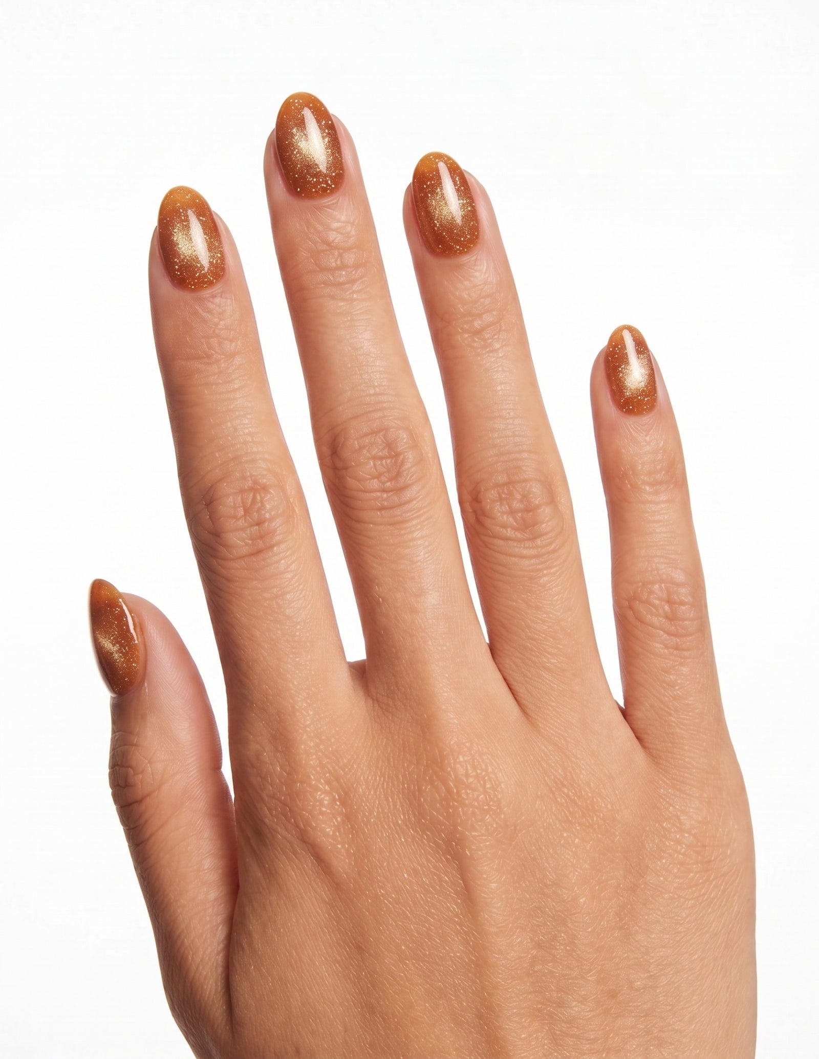 Cinnamon Velvet press-on nails — Almond (extra-short), tan hand, back of hand
