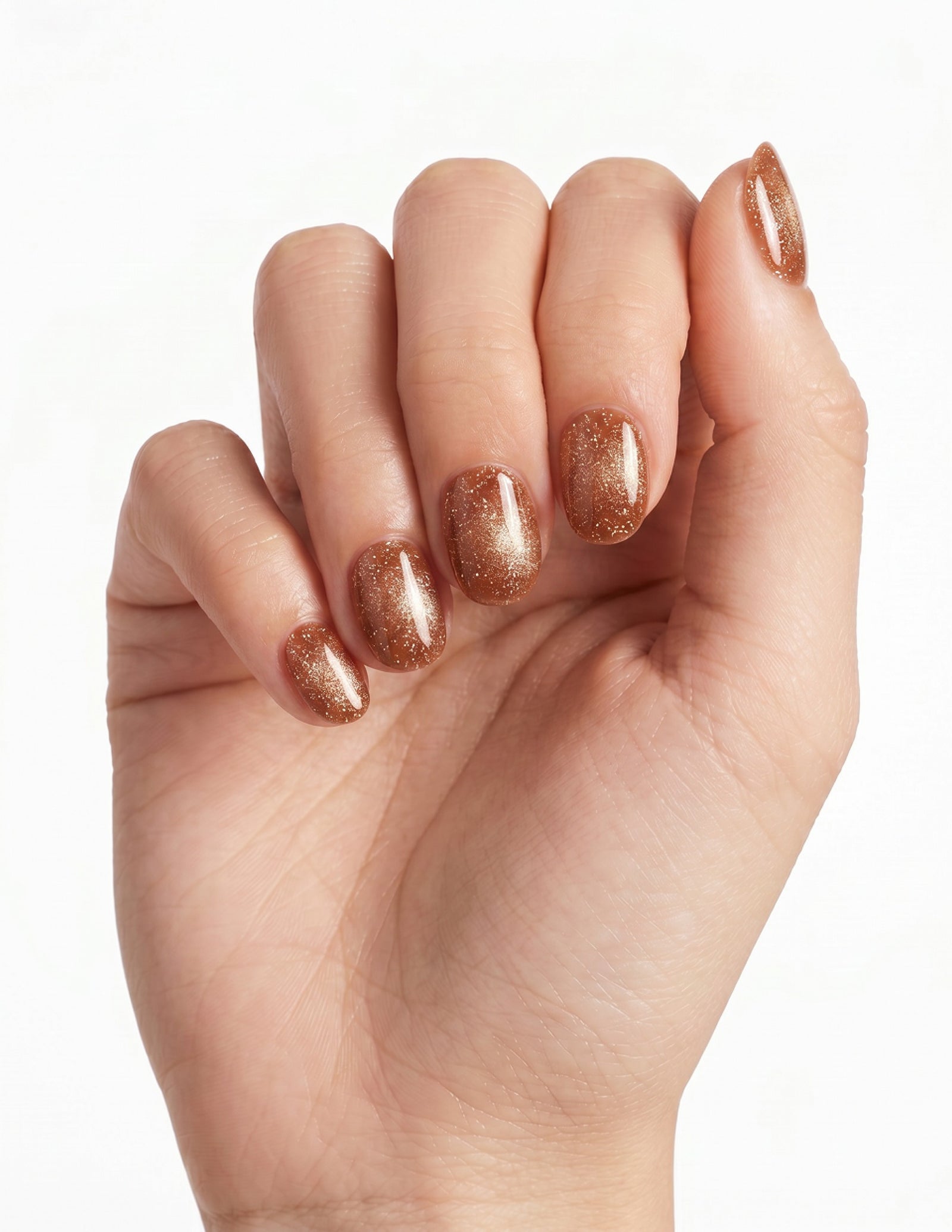 Cinnamon Velvet press-on nails — Oval (extra-short), light-skin hand, fingers curled
