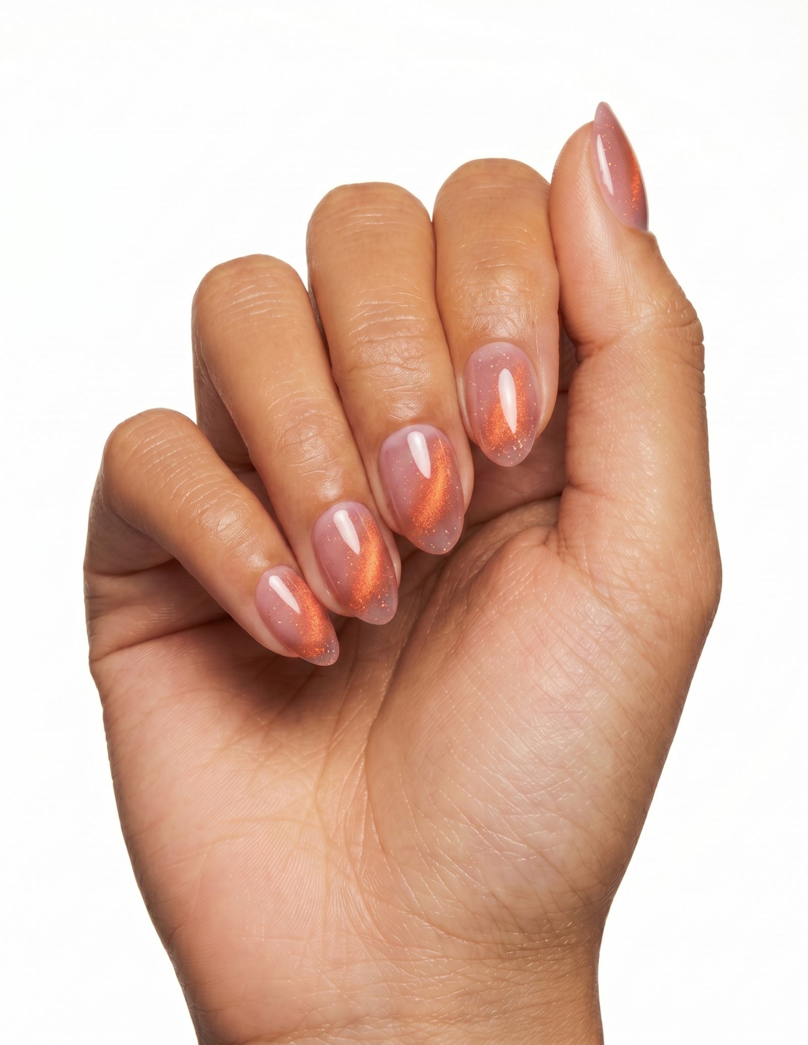 Spritz press-on nails — Almond (extra-short), tan hand, fingers curled