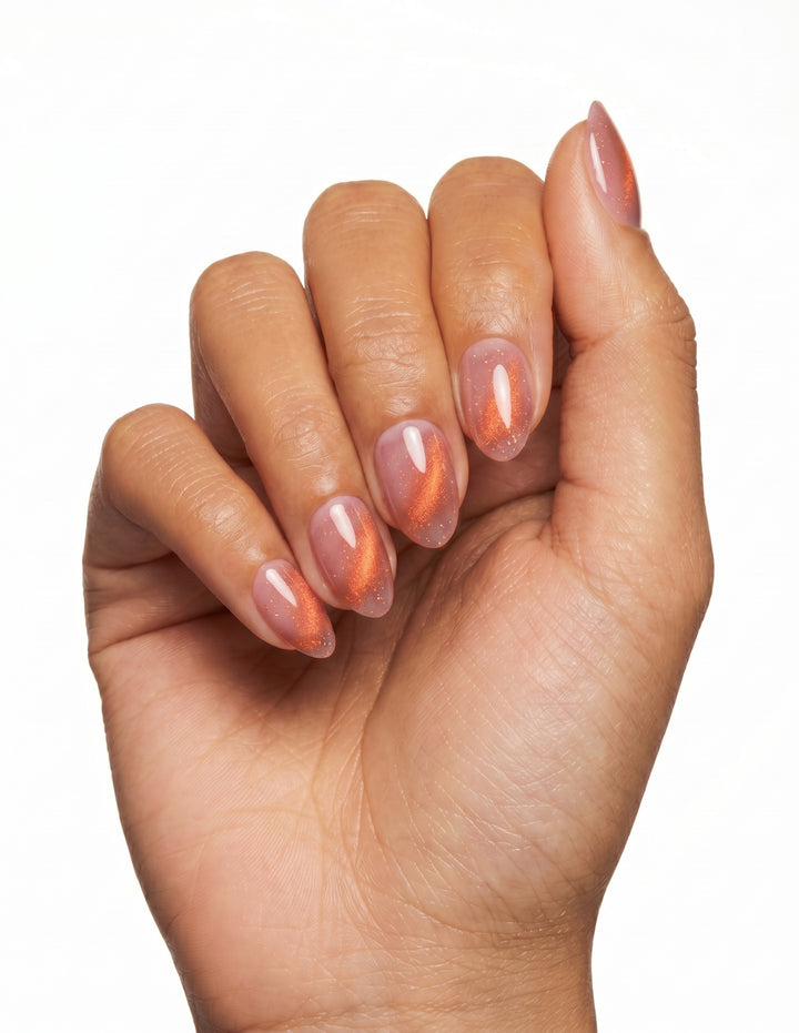 Spritz press-on nails — Almond (extra-short), tan hand, fingers curled