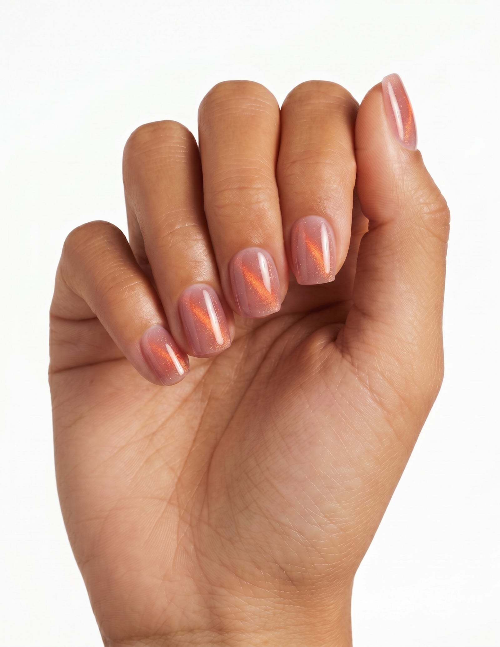 Spritz press-on nails — Coffin (short), tan hand, fingers curled