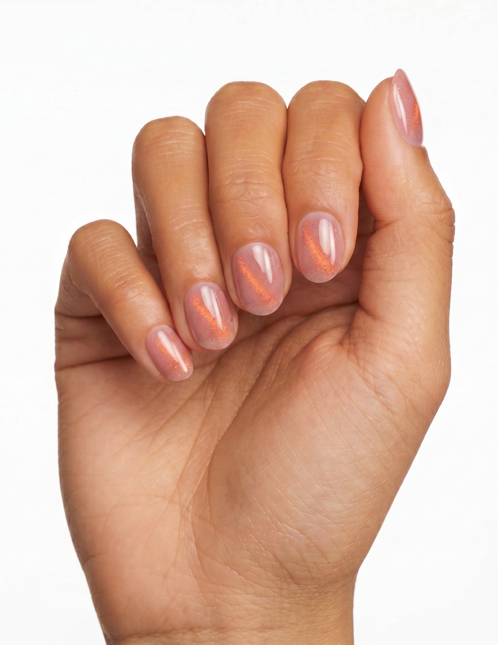 Spritz press-on nails — Oval (extra-short), deep-skin hand, fingers curled