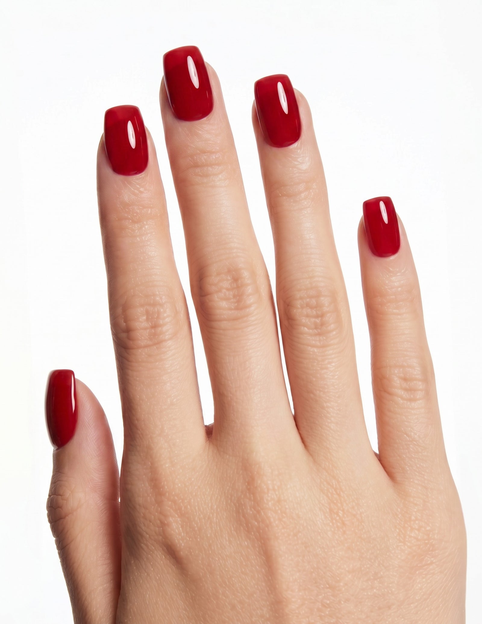 The Red press-on nails — Coffin (short), light-skin hand, back of hand